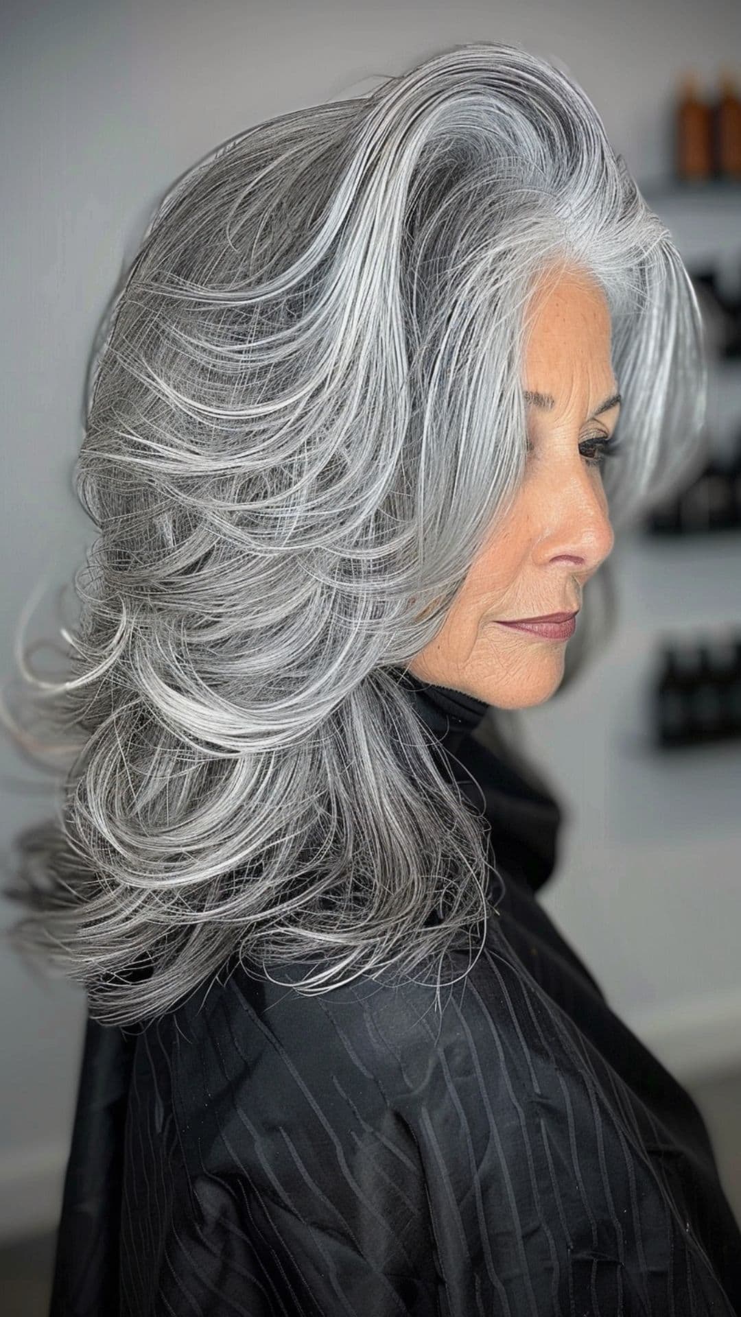 An old woman modelling a salt and pepper hair color.