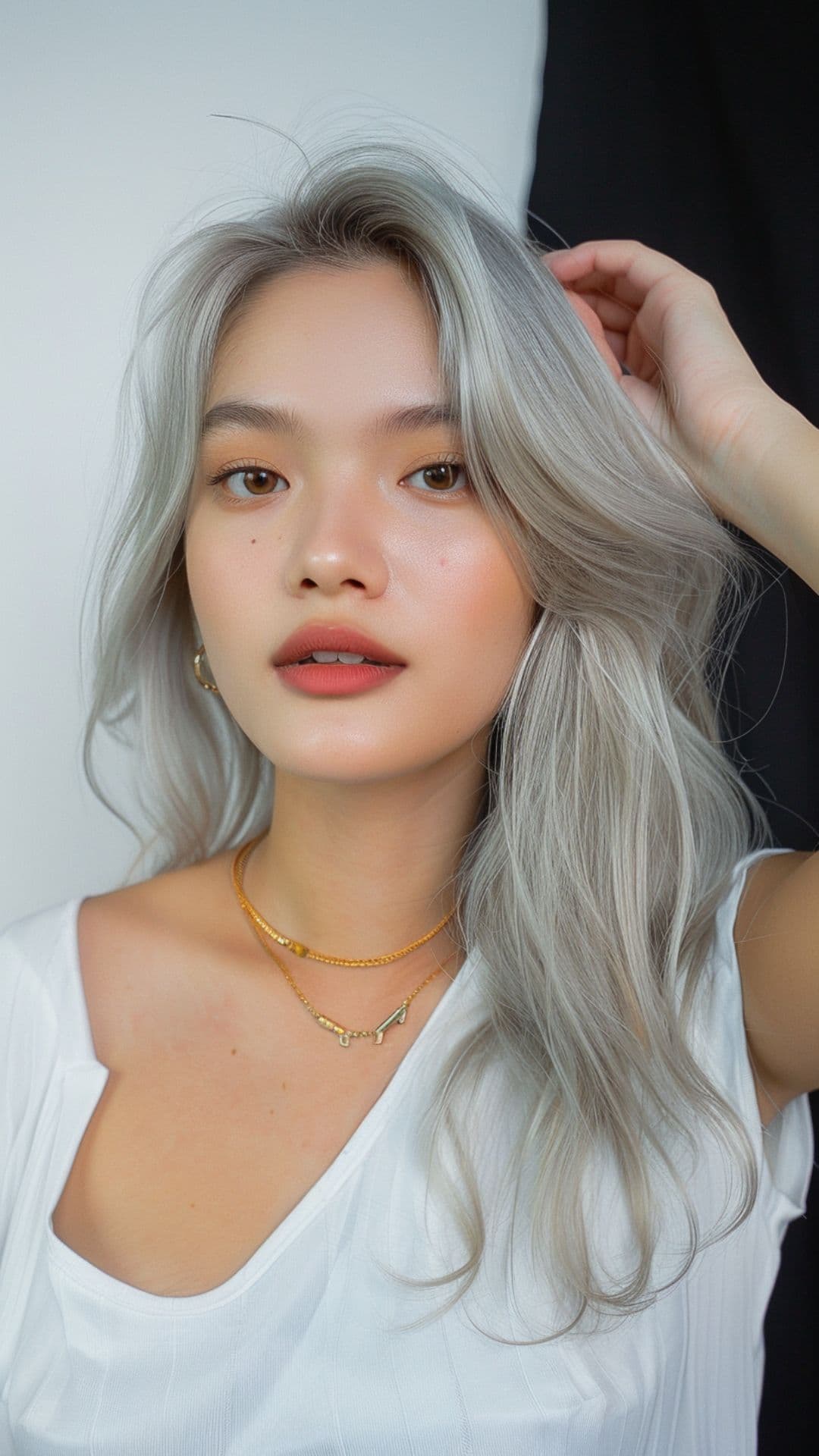 A woman modelling a silver ash gray hair.