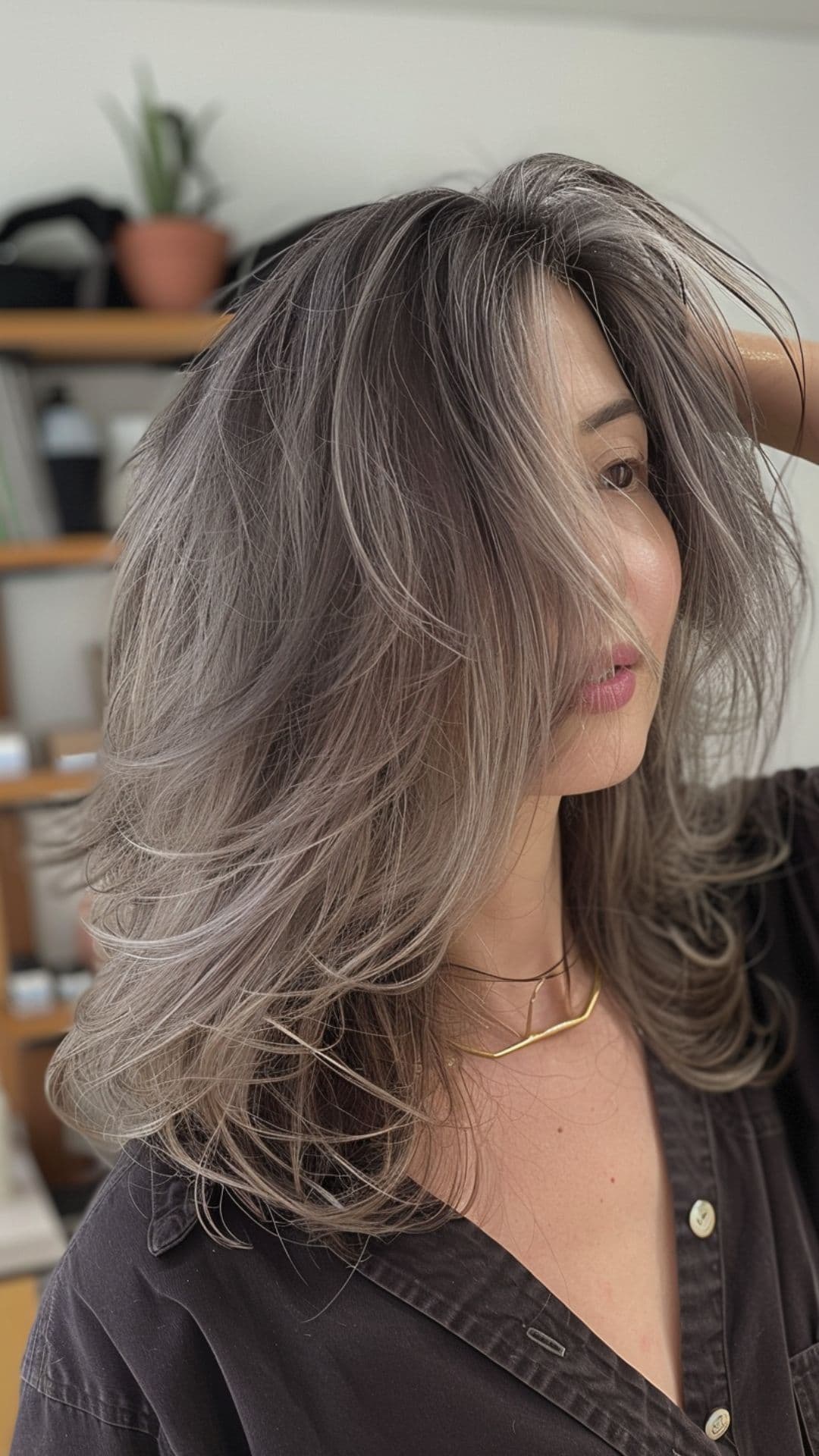 A woman modelling a steel gray hair.