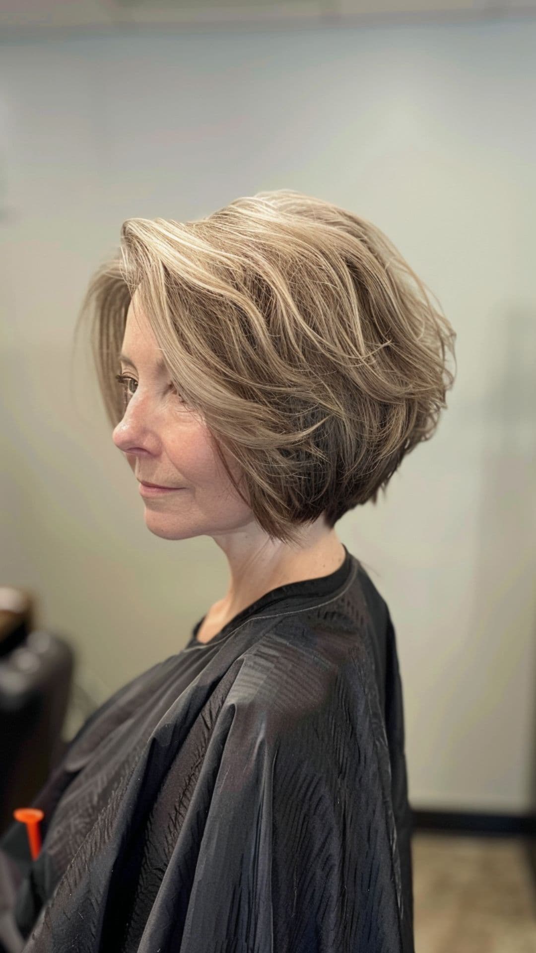 An older woman modelling a textured bob cut.