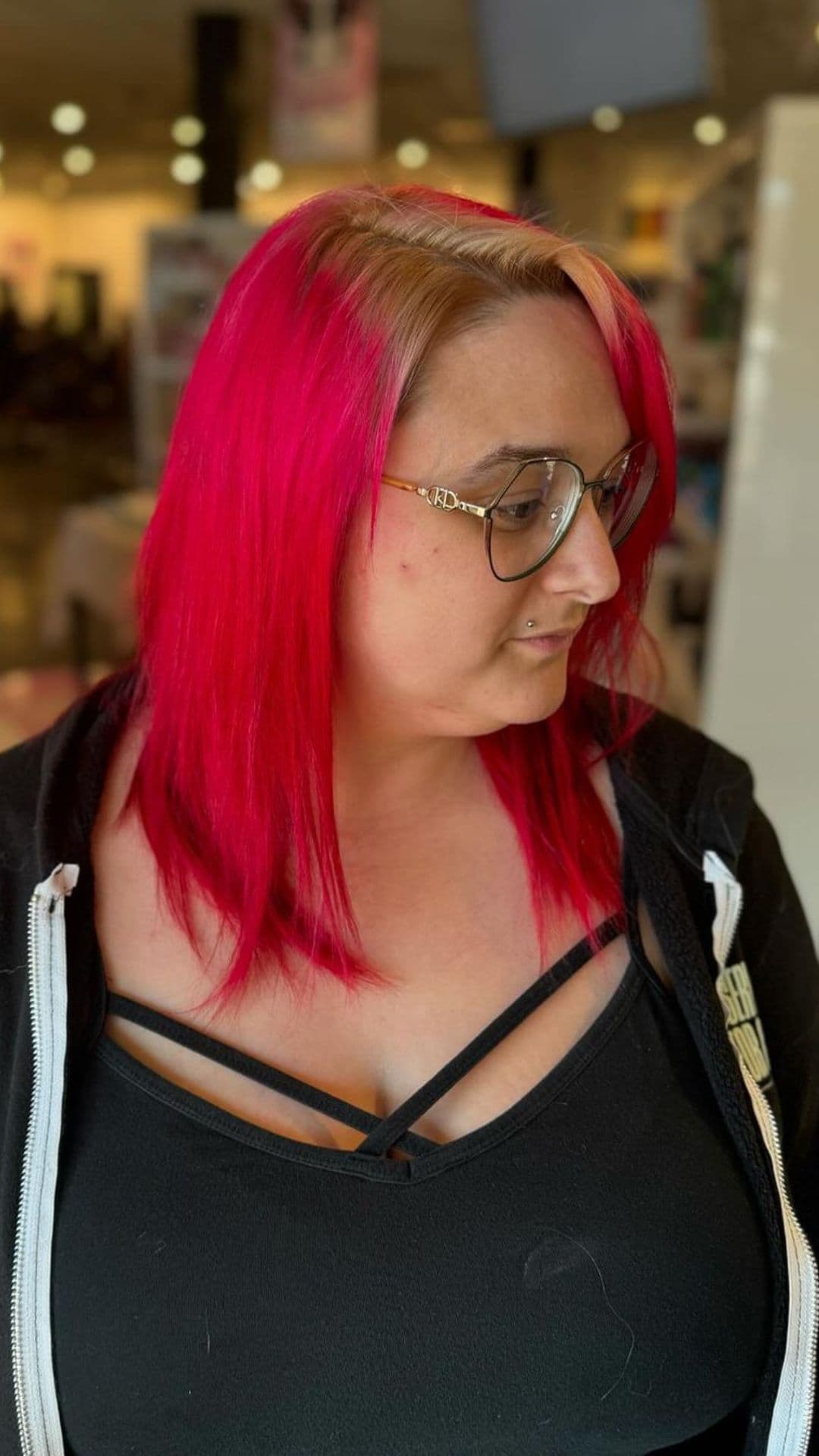 A woman modelling a red blowout hairstyle.