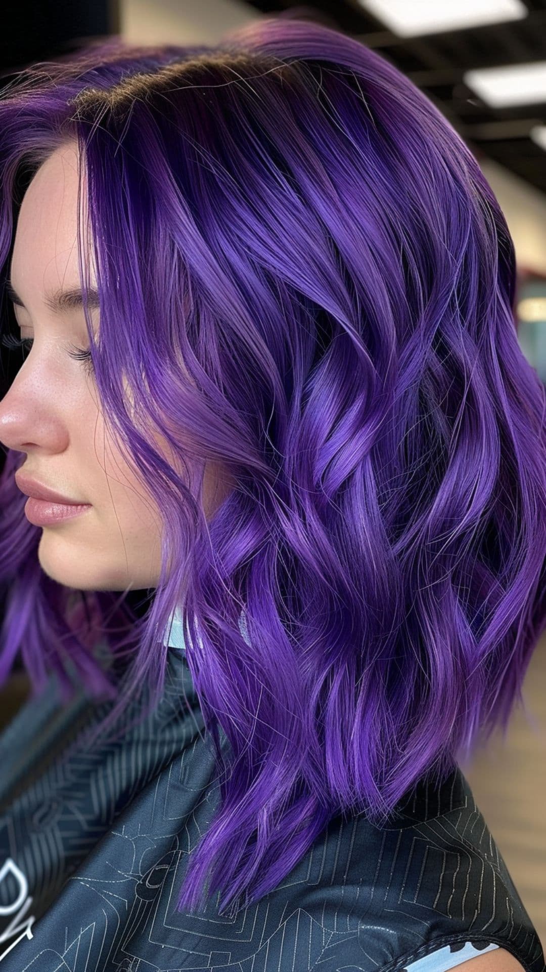 A woman modelling an ultraviolet hair color.