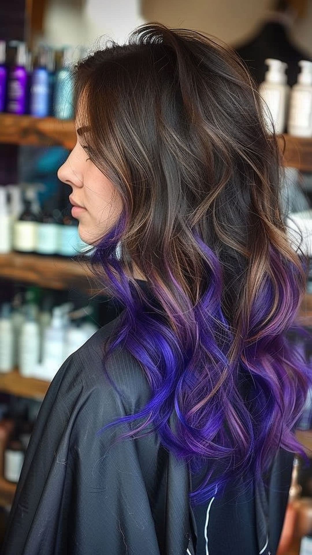 A woman modelling a violet ombre hair color.