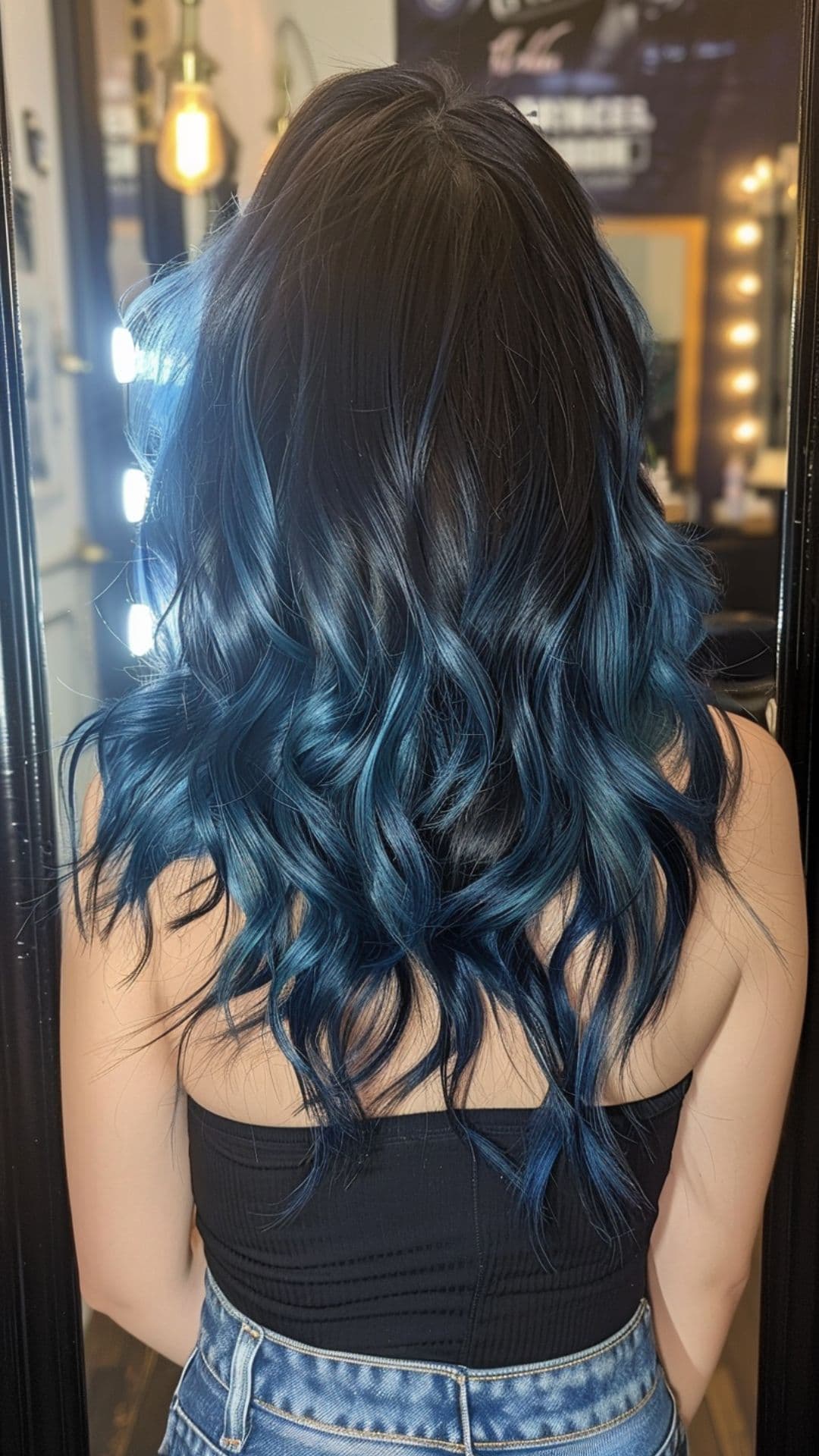 A woman modelling a black and blue hair.
