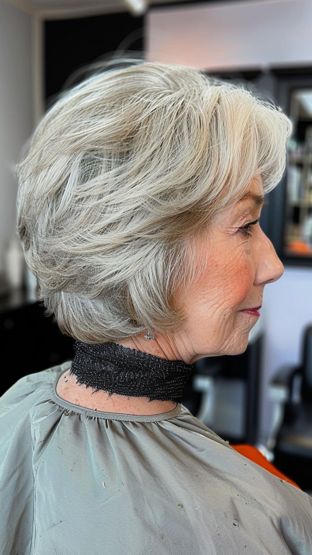 An old woman modelling a classic layered bob cut.