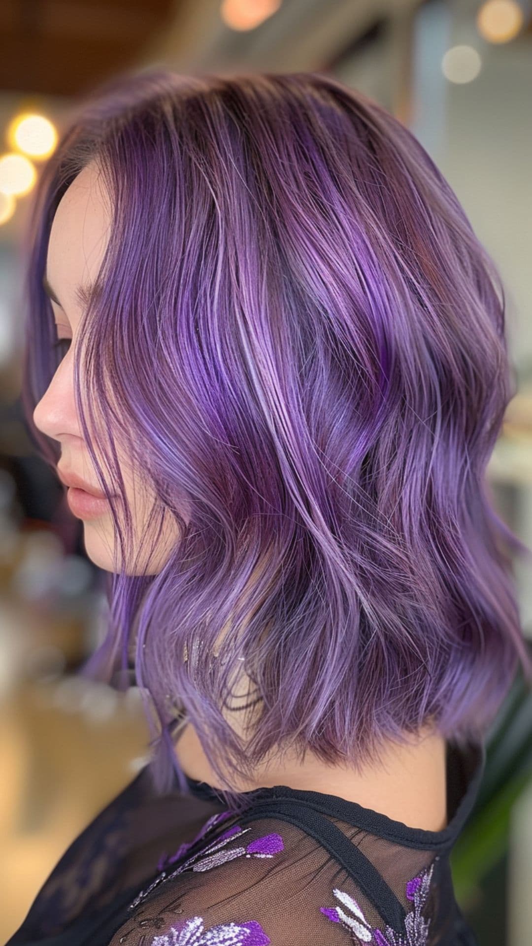 A young woman modelling a frosted lavender hair.