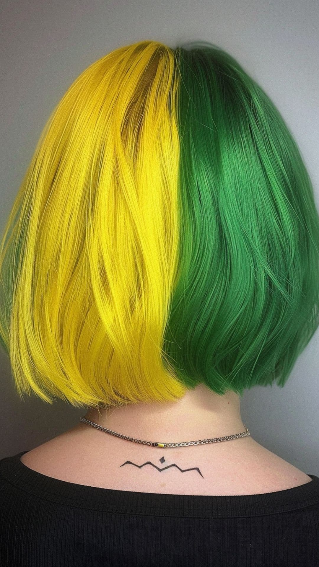 A woman modelling a green and yellow hair.