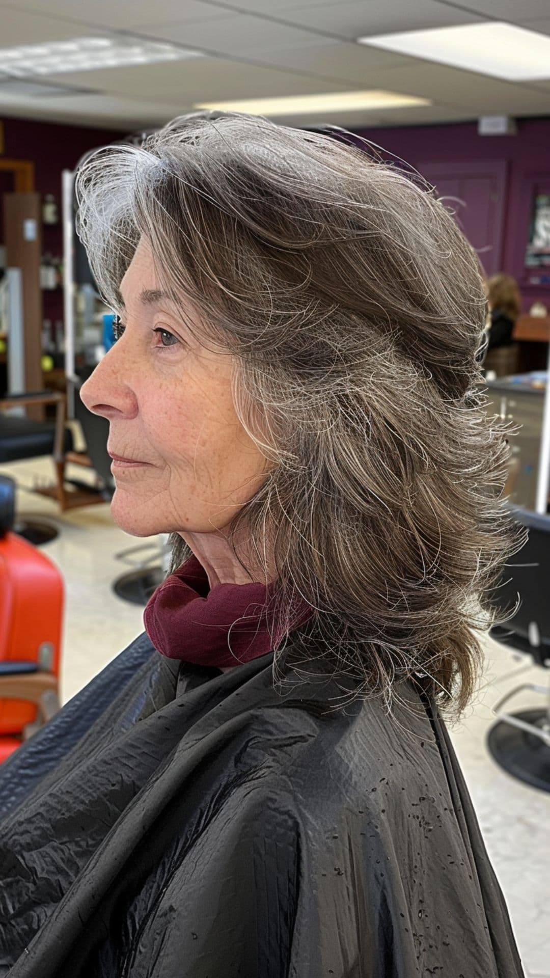An old woman modelling a layered shag cut.