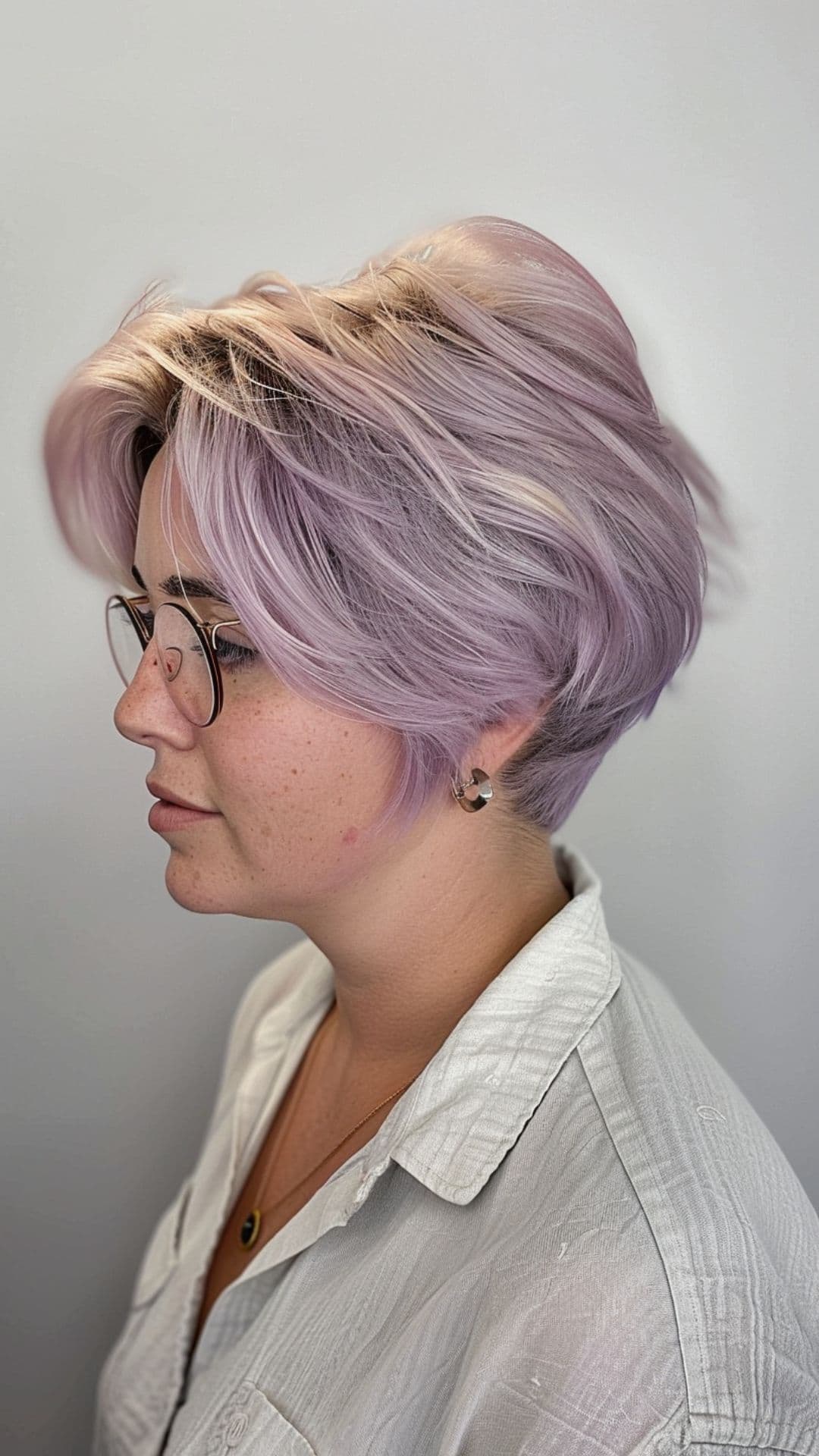 A woman modelling a short lilac hair.
