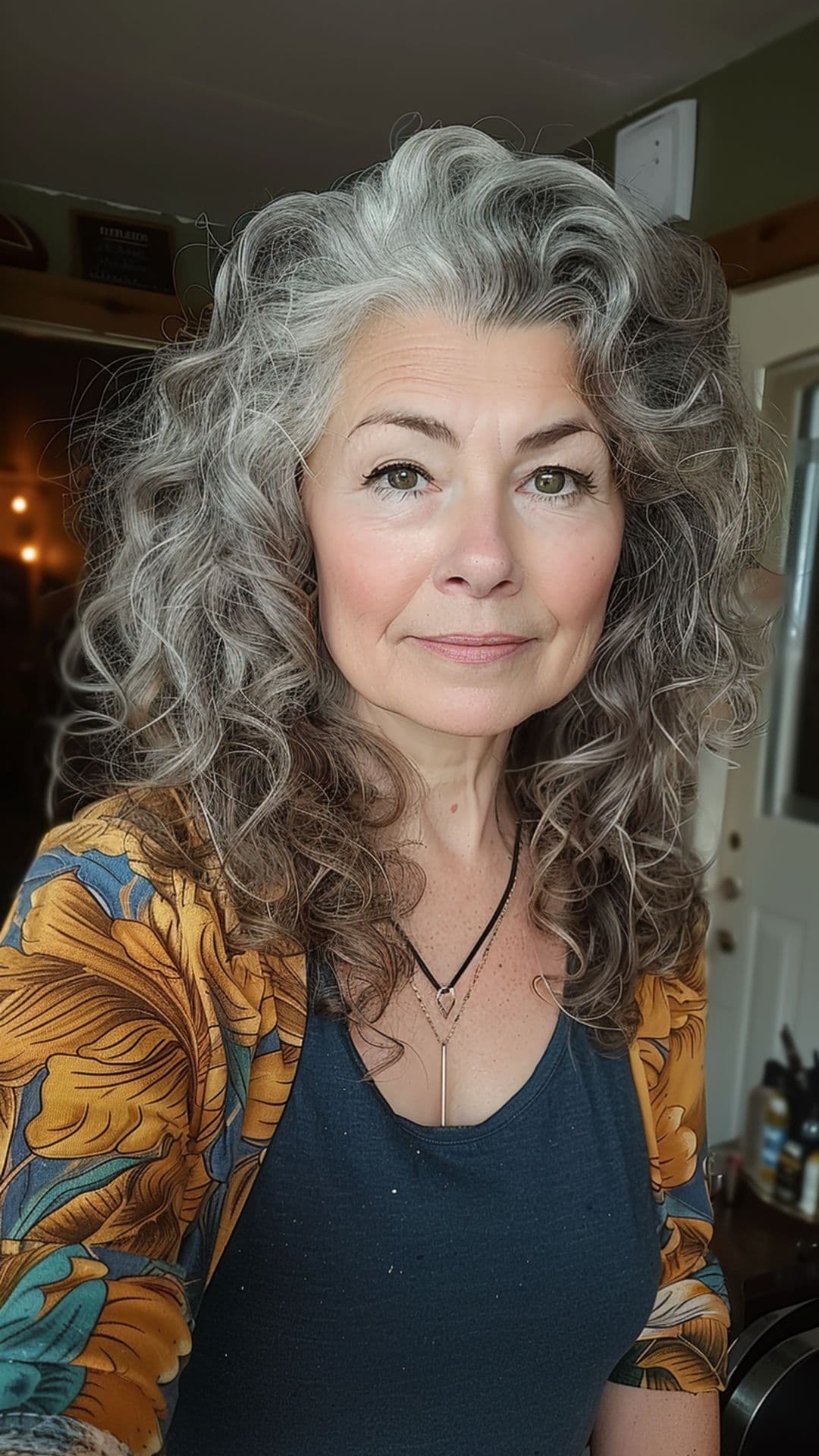 An old woman modelling her natural curls.