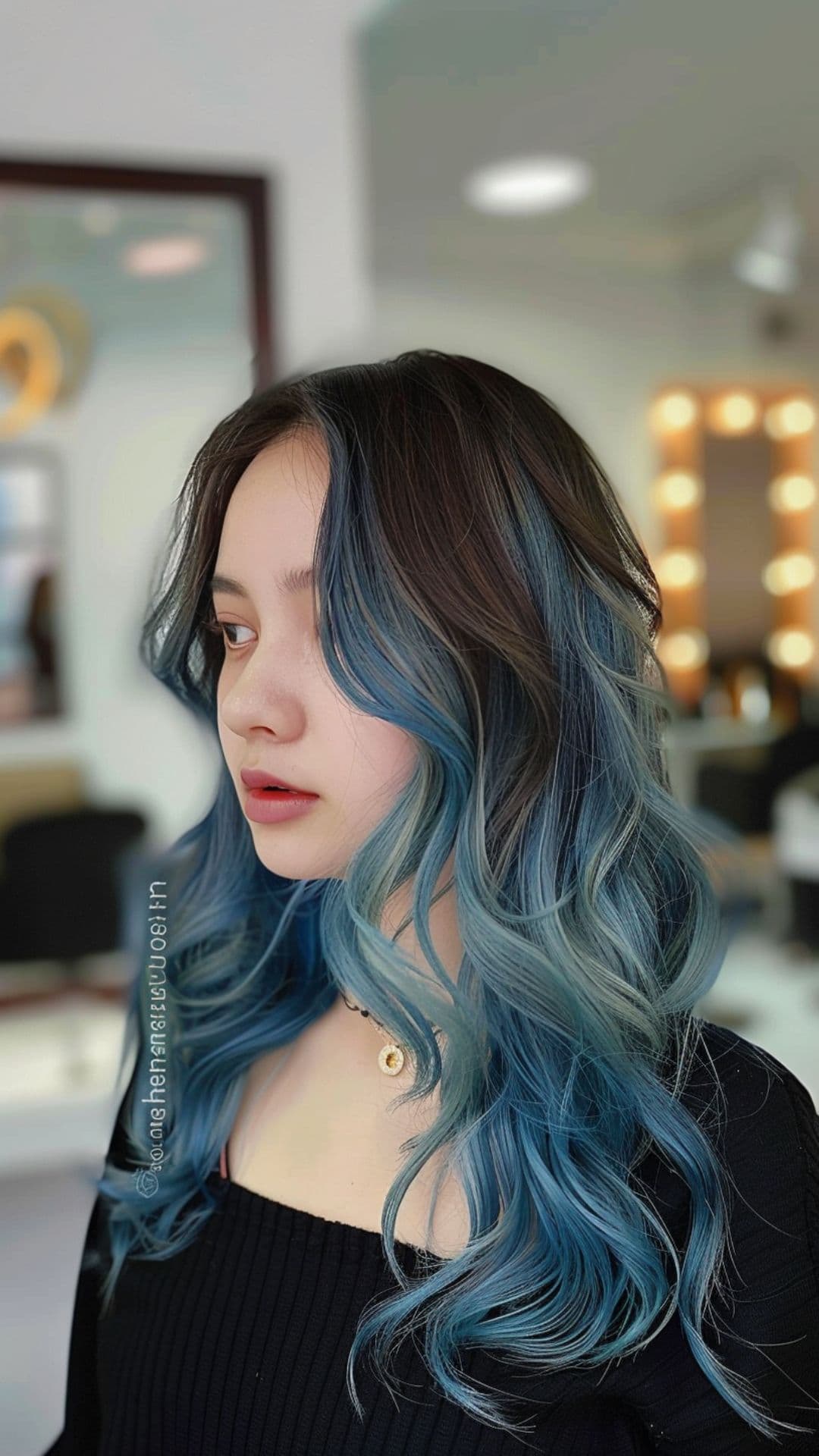 A young woman modelling a blue ombre hair.