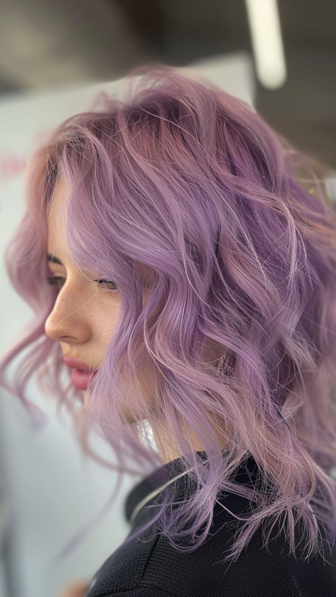 A woman modelling a pastel purple hair.