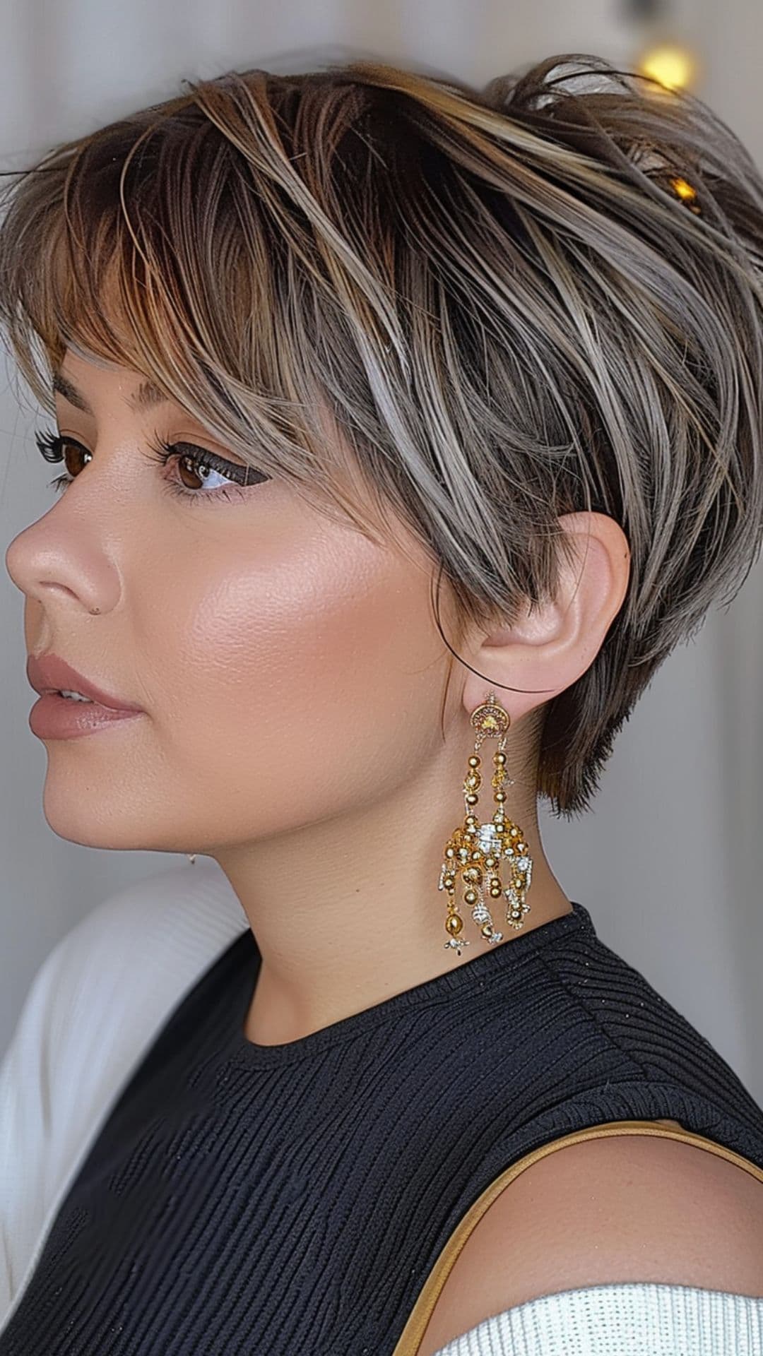 A woman modelling a pixie cut with choppy textured layers.