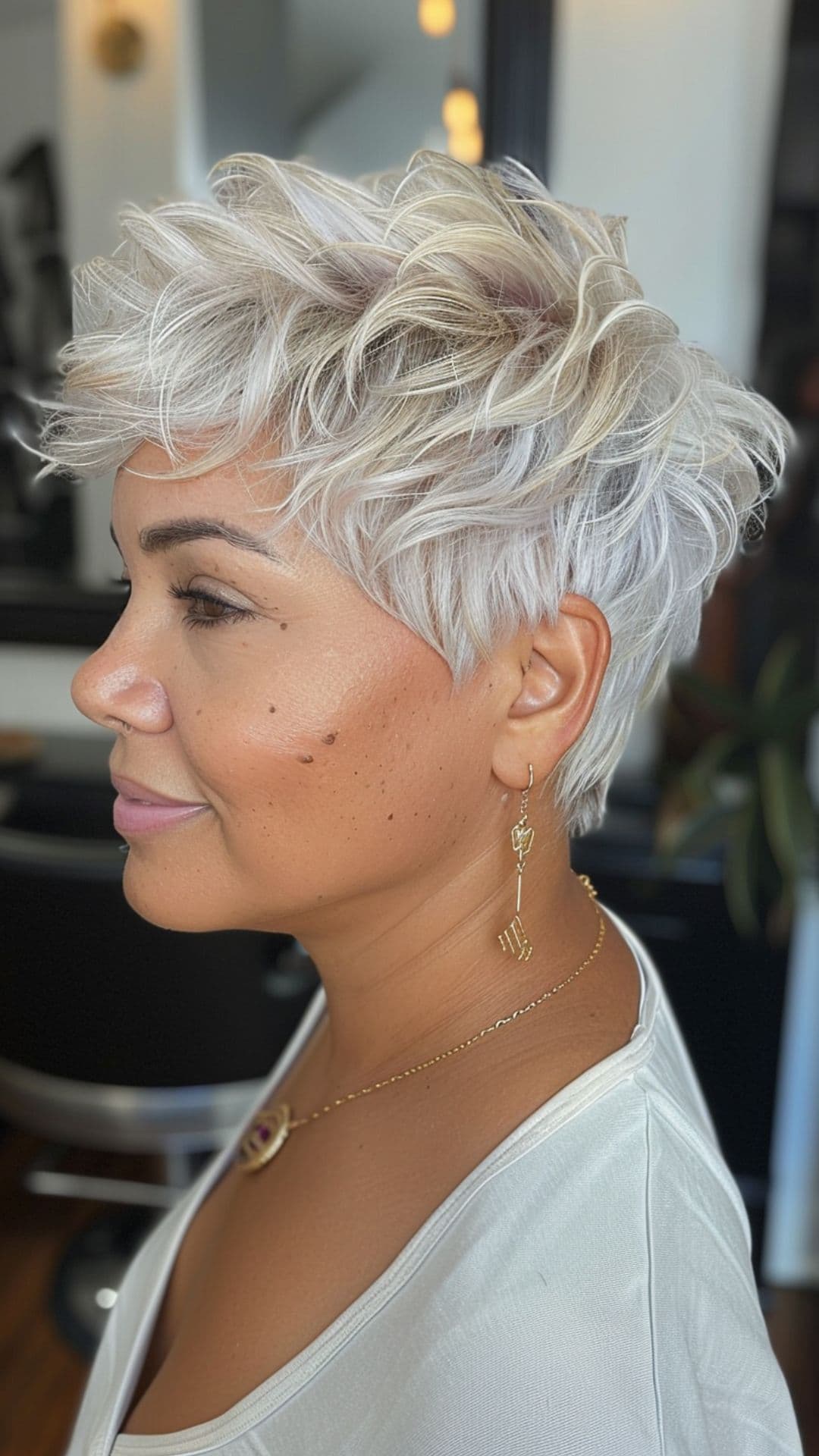 A woman modelling a short platinum blonde hair.