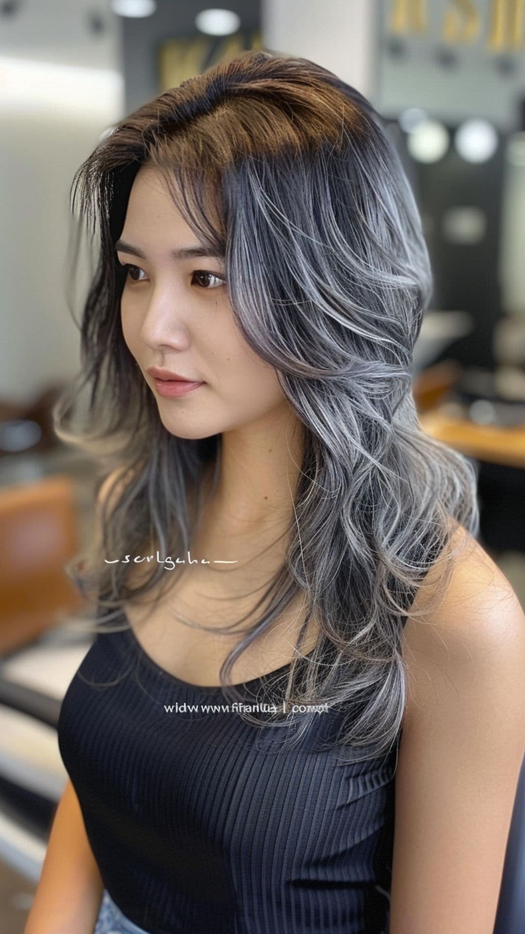A woman modelling a soft silver highlights hair.