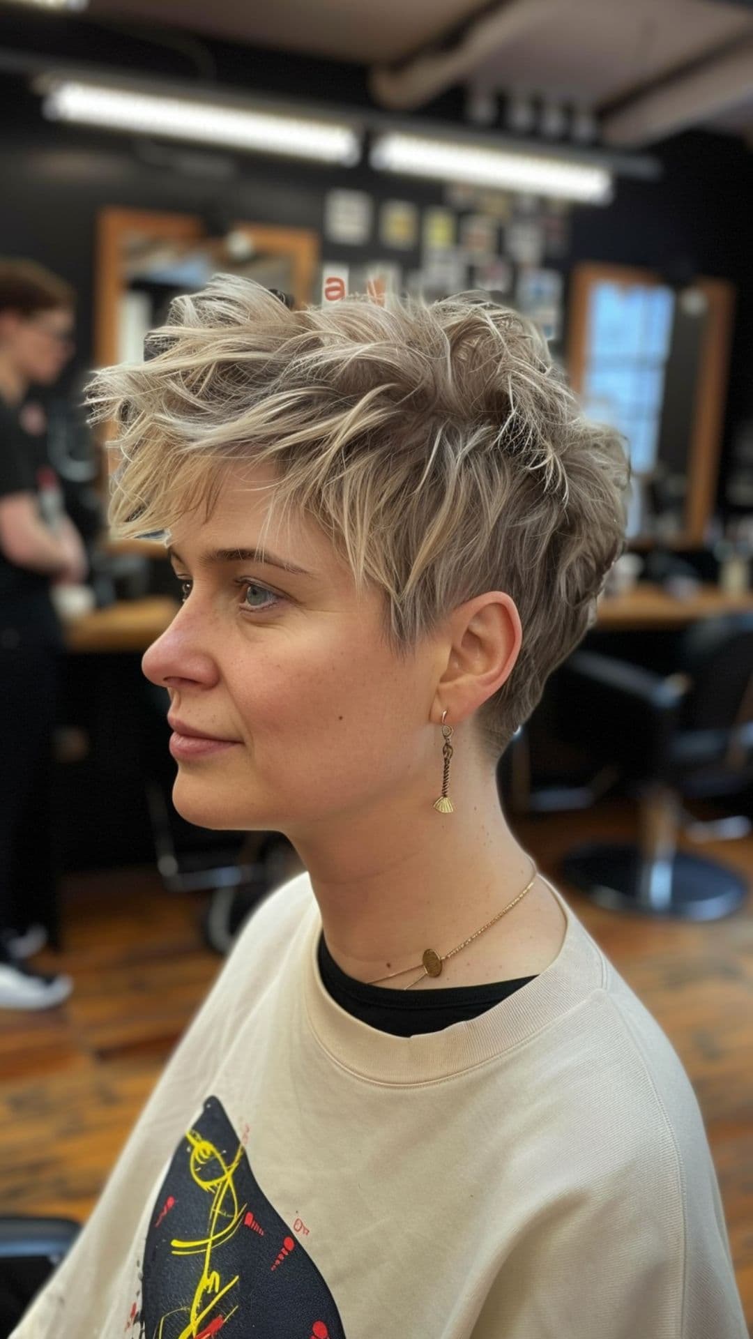 A woman modelling a spiky pixie with tousled look.