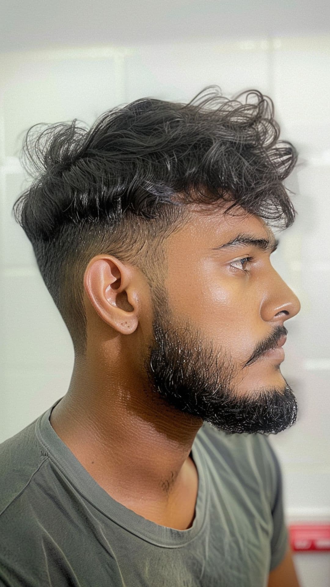 A man modelling a textured fringe with beard.