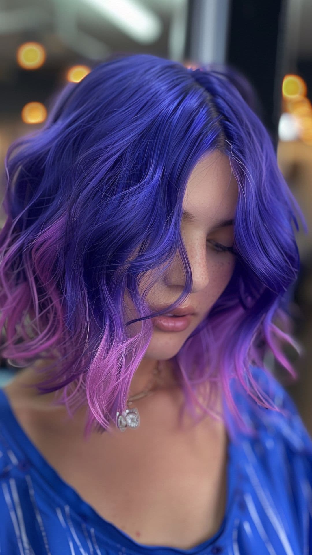A woman modelling an ultra violet hair.