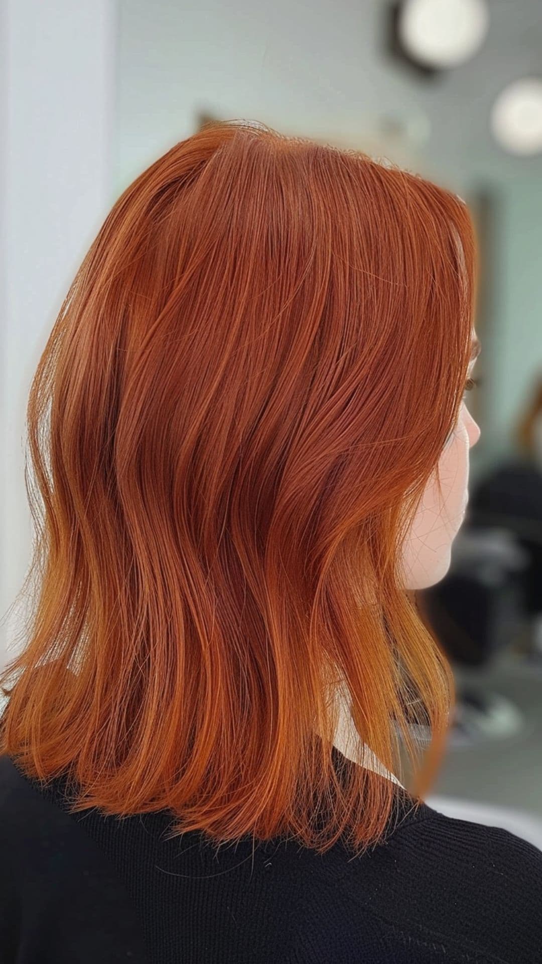 A woman modelling a copper red hair.