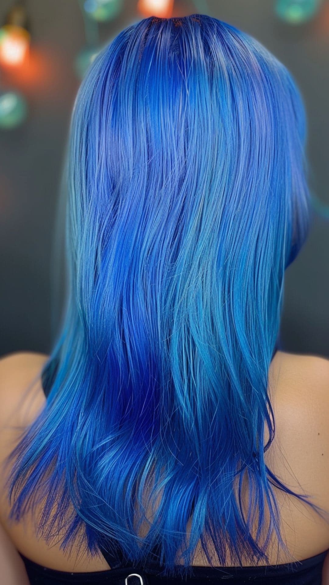 A woman modelling an electric blue hair.