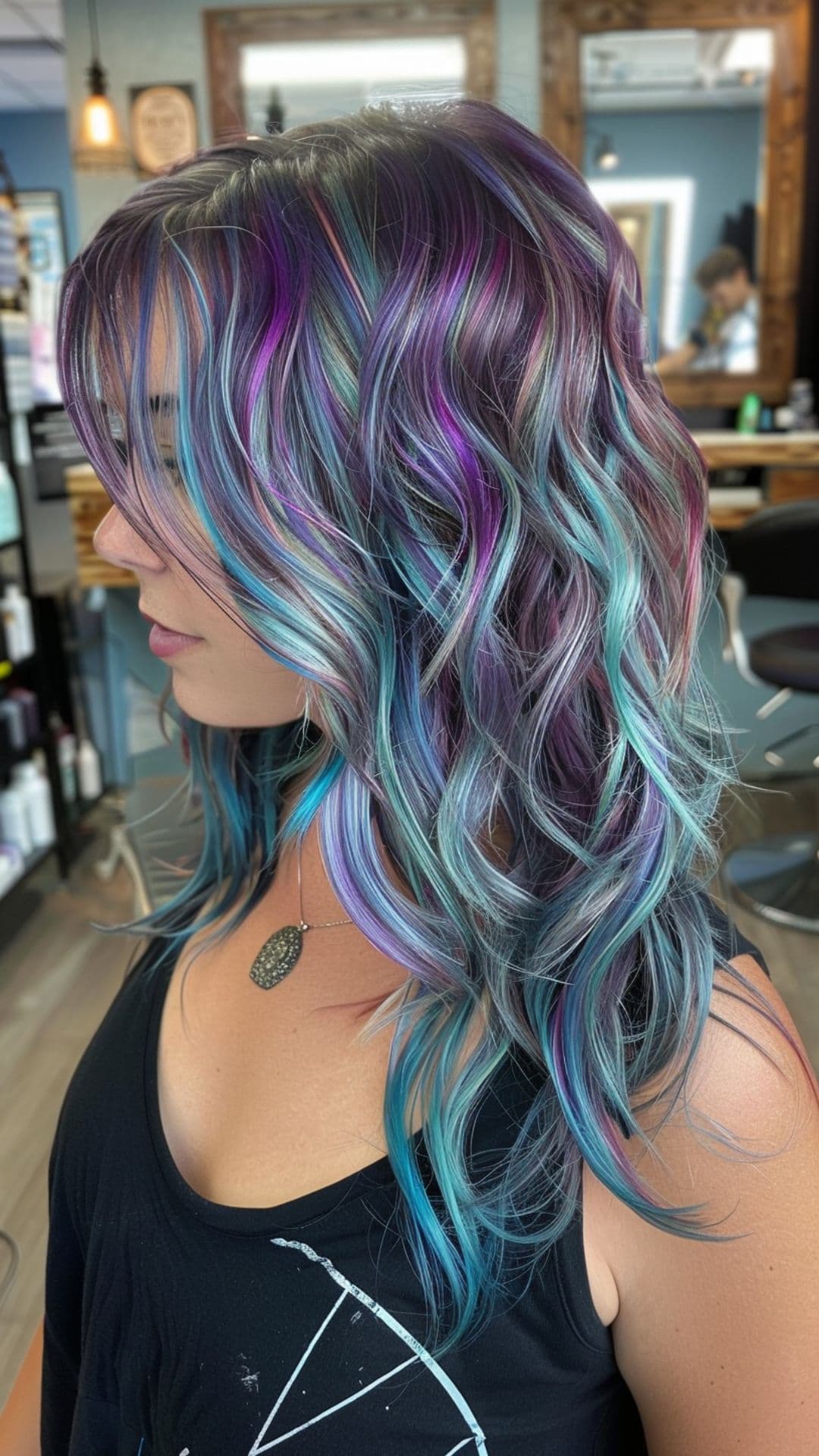 A woman modelling a teal and purple hair.