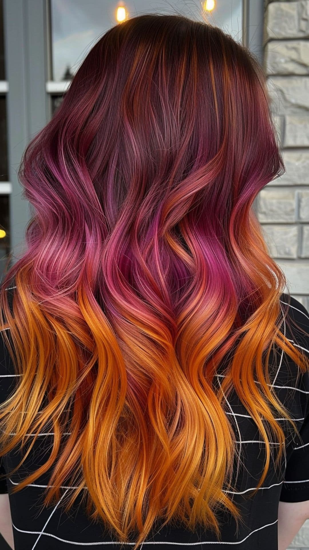 A woman modelling a sunset ombre hair.