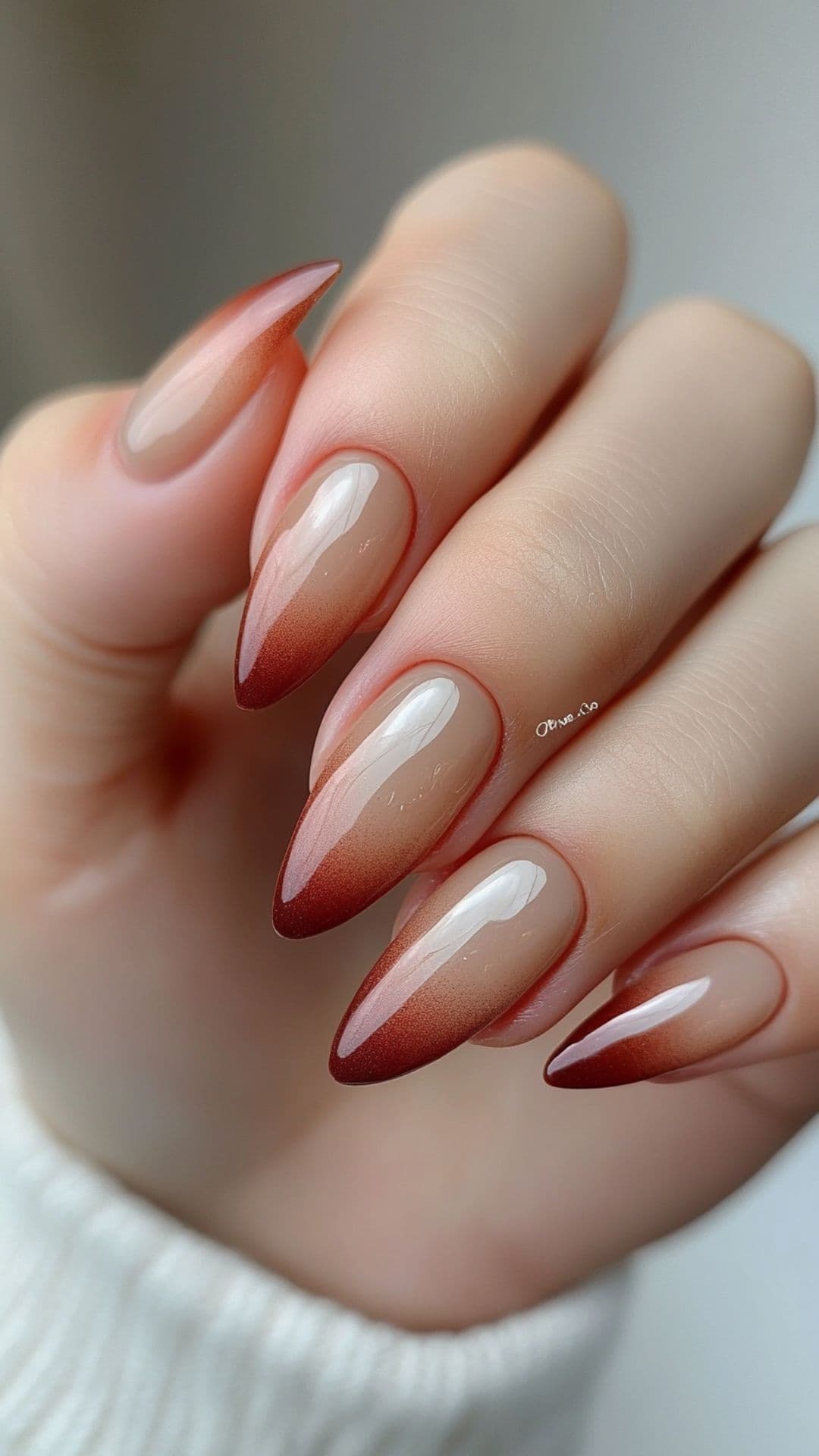 Woman's nails with Gradient Ombre in Rust and Beige.