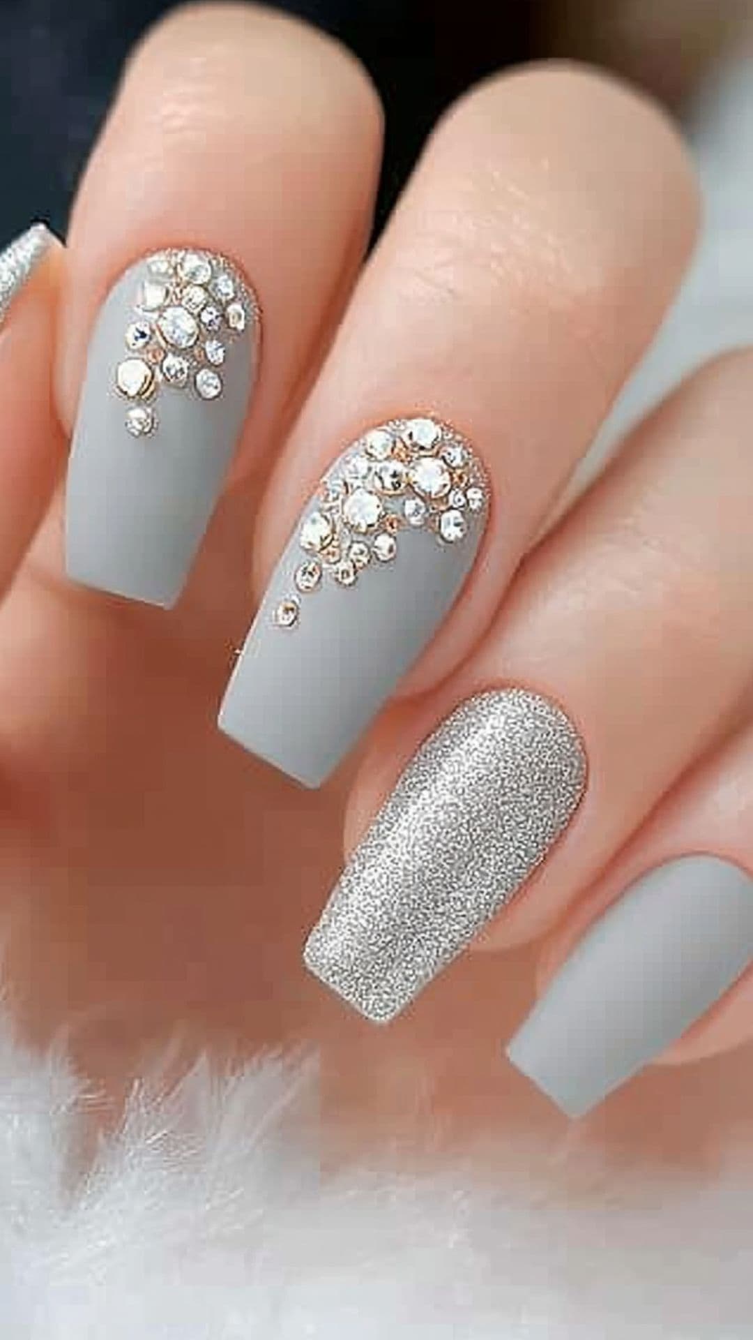 Woman's nails in Muted Gray with Rhinestones.