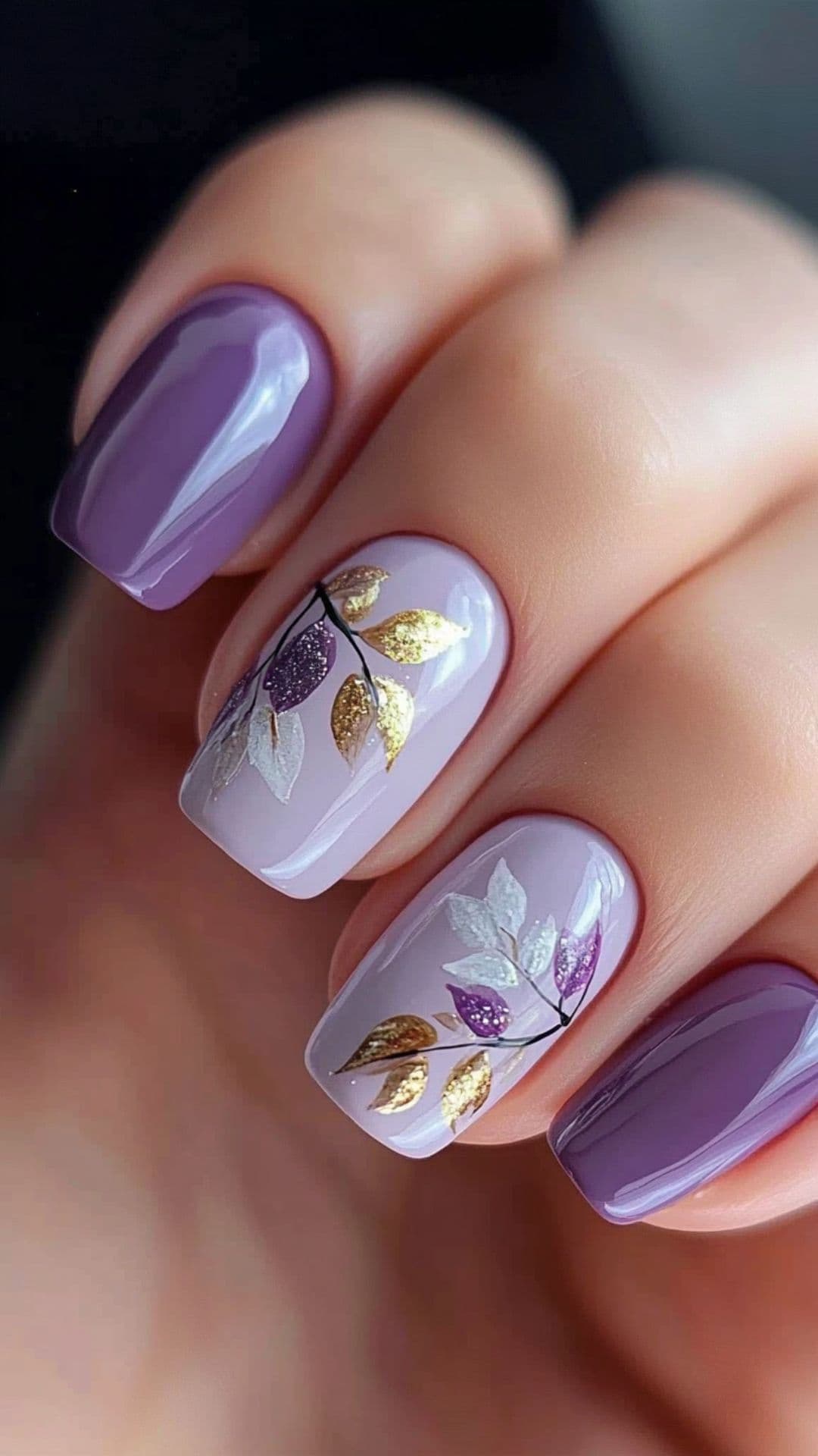 Woman's nails in Muted Purple with Leaf Patterns design.