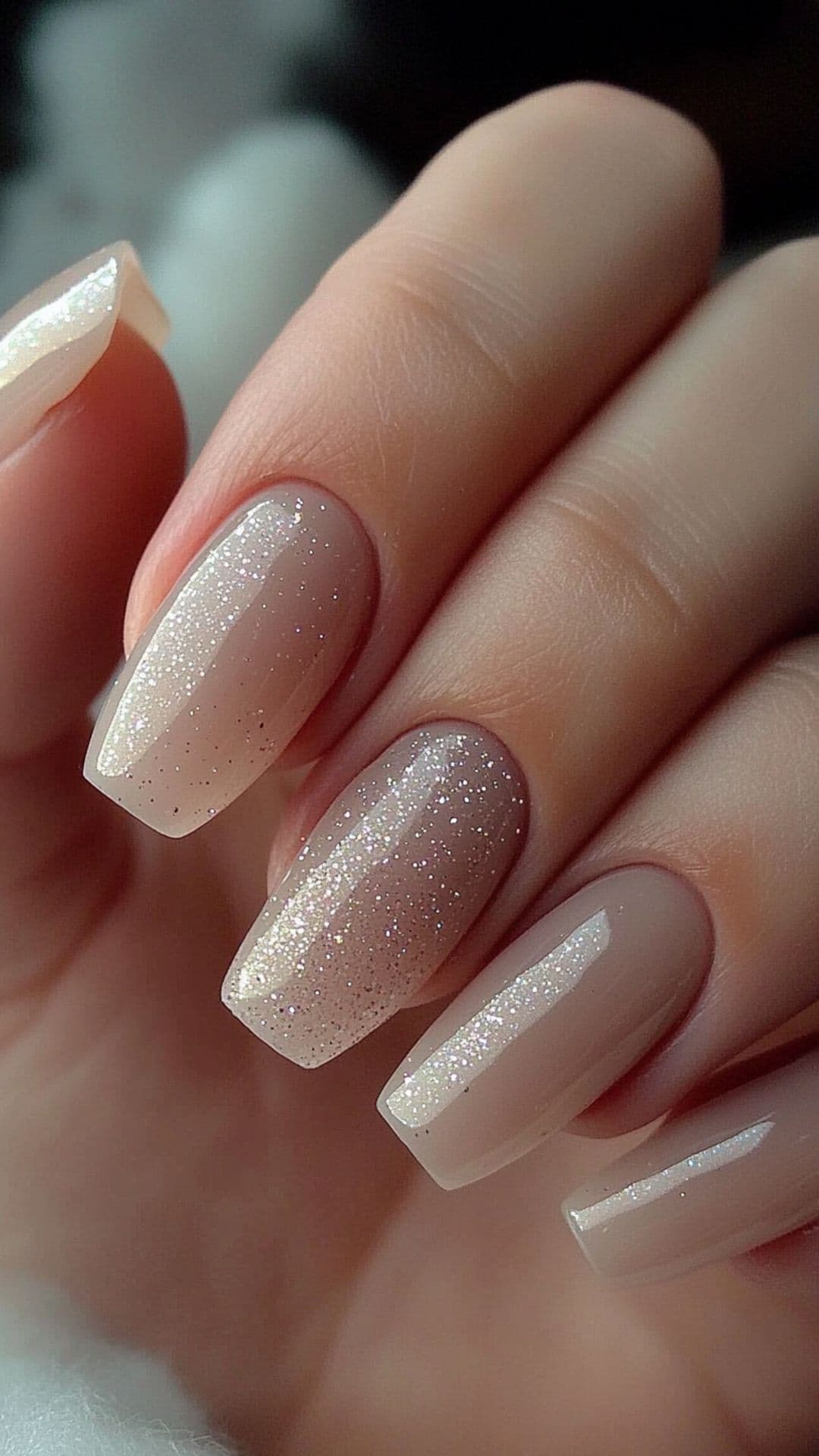 Woman's nails with Neutral Tones with Subtle Sparkle.