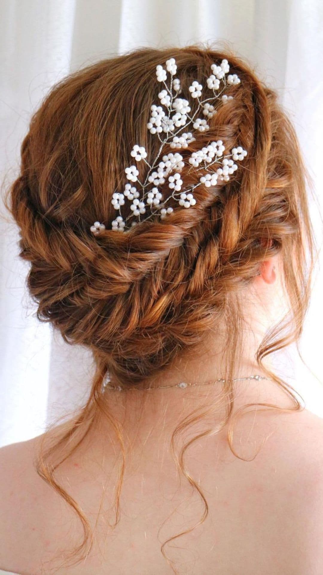 A woman modelling a Crown of Twists hairstyle.