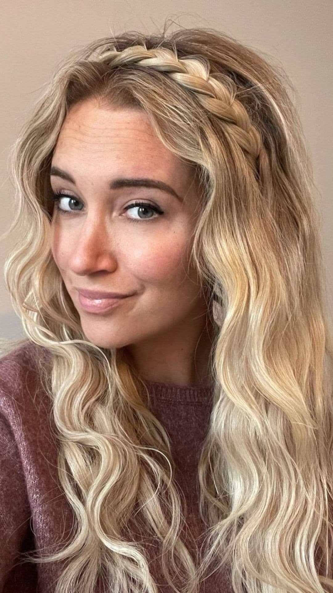 A woman modelling a Braided Headband hairstyle.