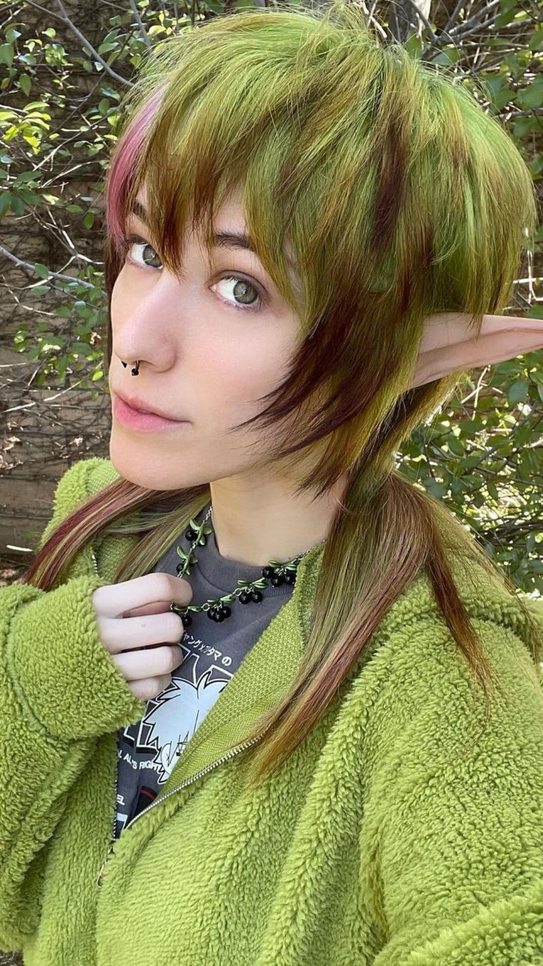 A woman modelling a Brown and Green Mullet hairstyle.