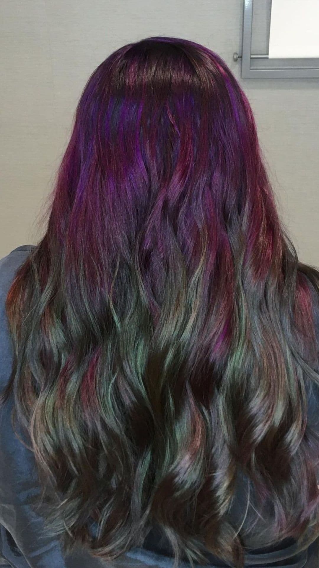 Back view of long, wavy hair with Plum and Pine colors.