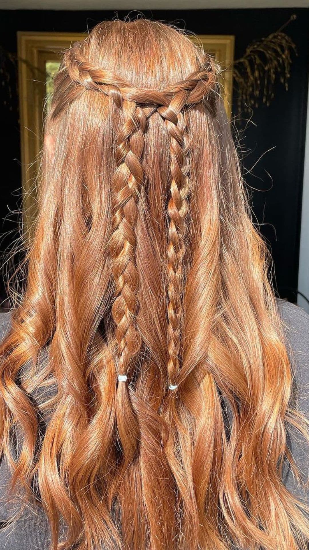 A woman modelling a Half-Up Braid hairstyle.