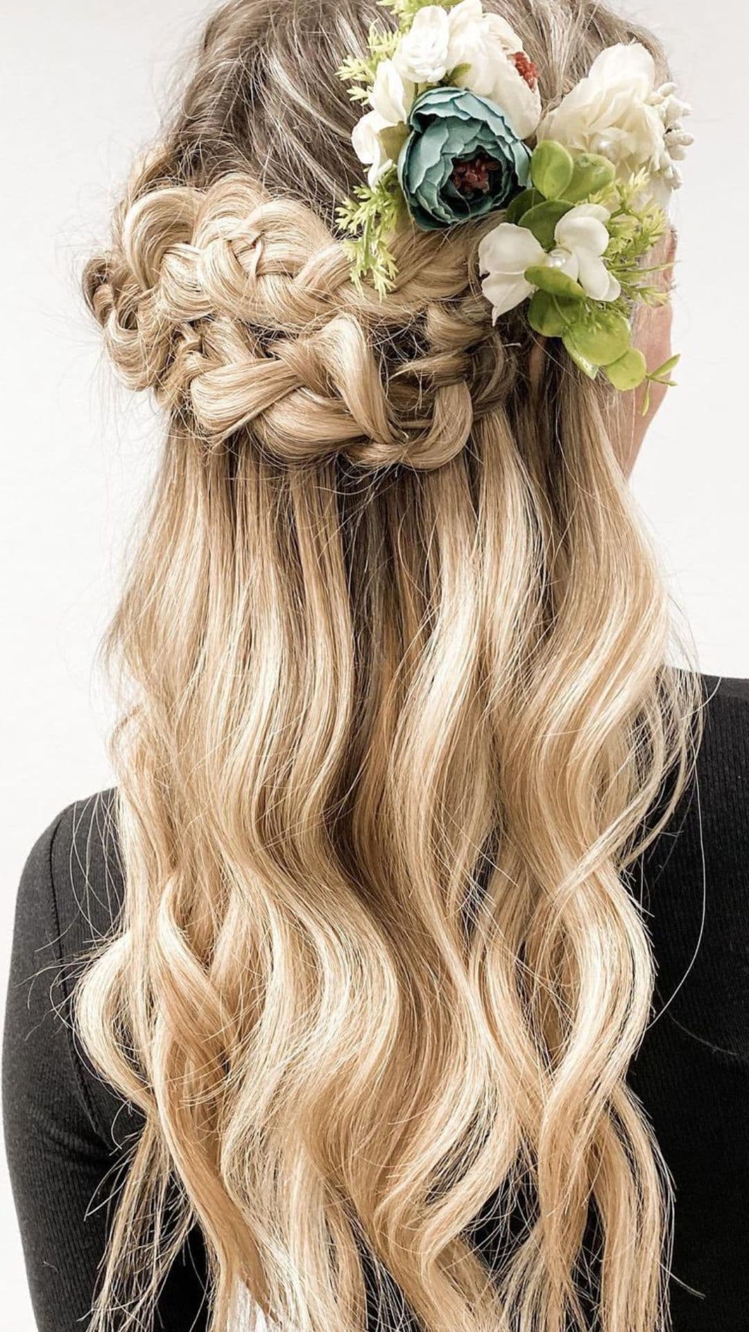 A woman modelling a Nature-Inspired Half-Up Style hairstyle.