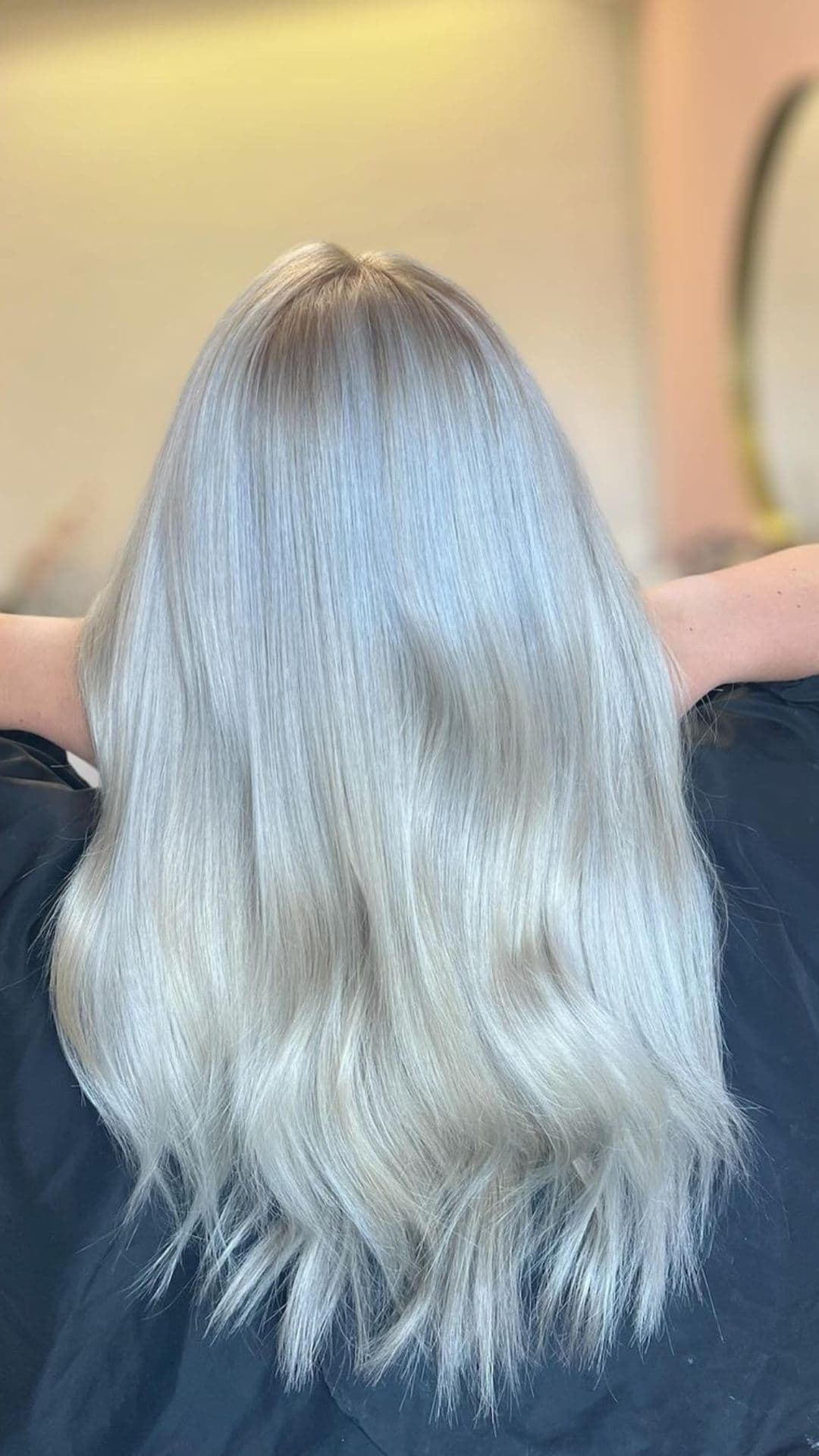 Ash Blonde hairstyle showcased on long, straight hair.