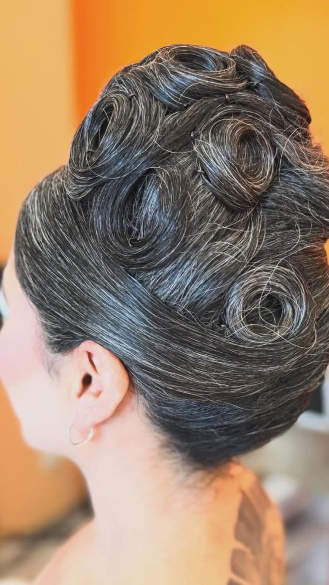 An old woman modelling a Bouffant Updo hairstyle.