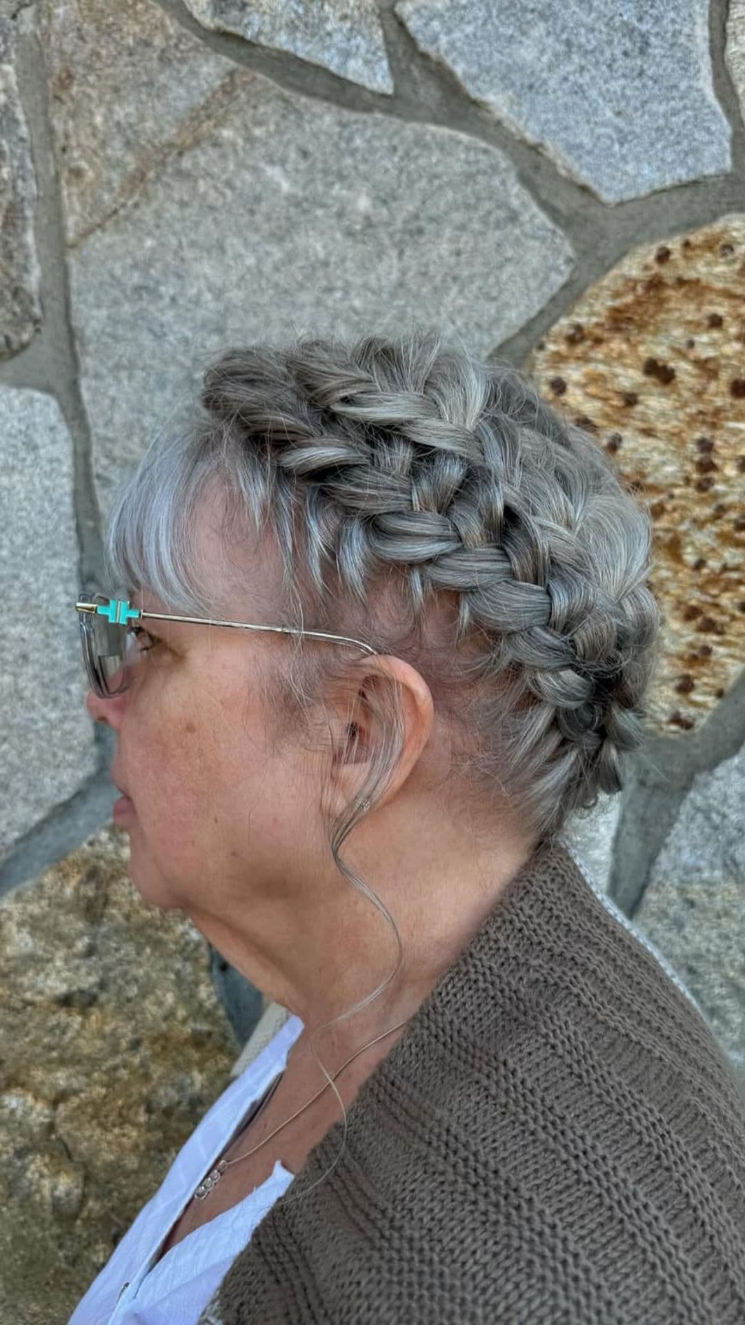 An old woman modelling a Braided Crown Updo hairstyle.