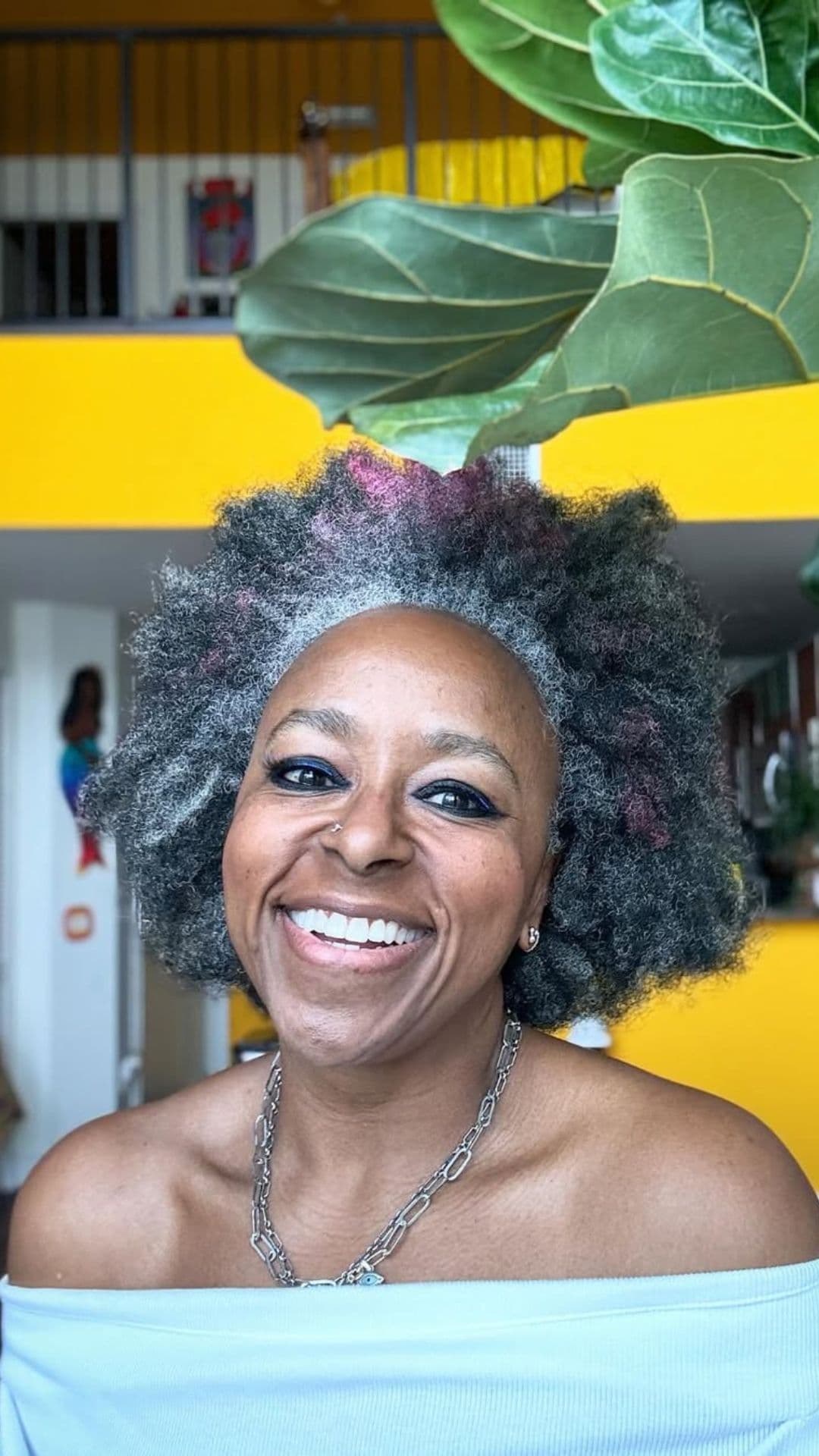 A Black old woman with a Classic Short Afro hairstyle.