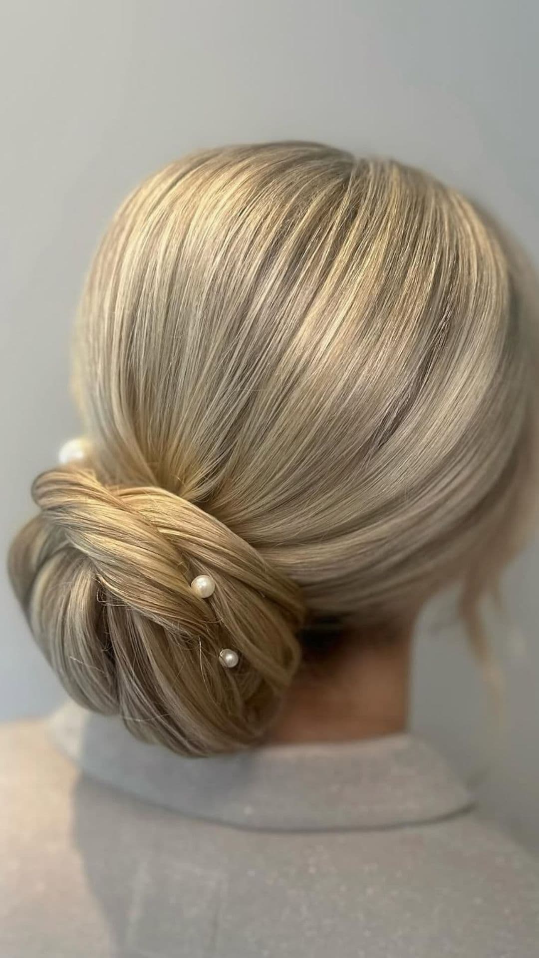 An old woman modelling a Elegant Bun with Hair Accessories hairstyle.
