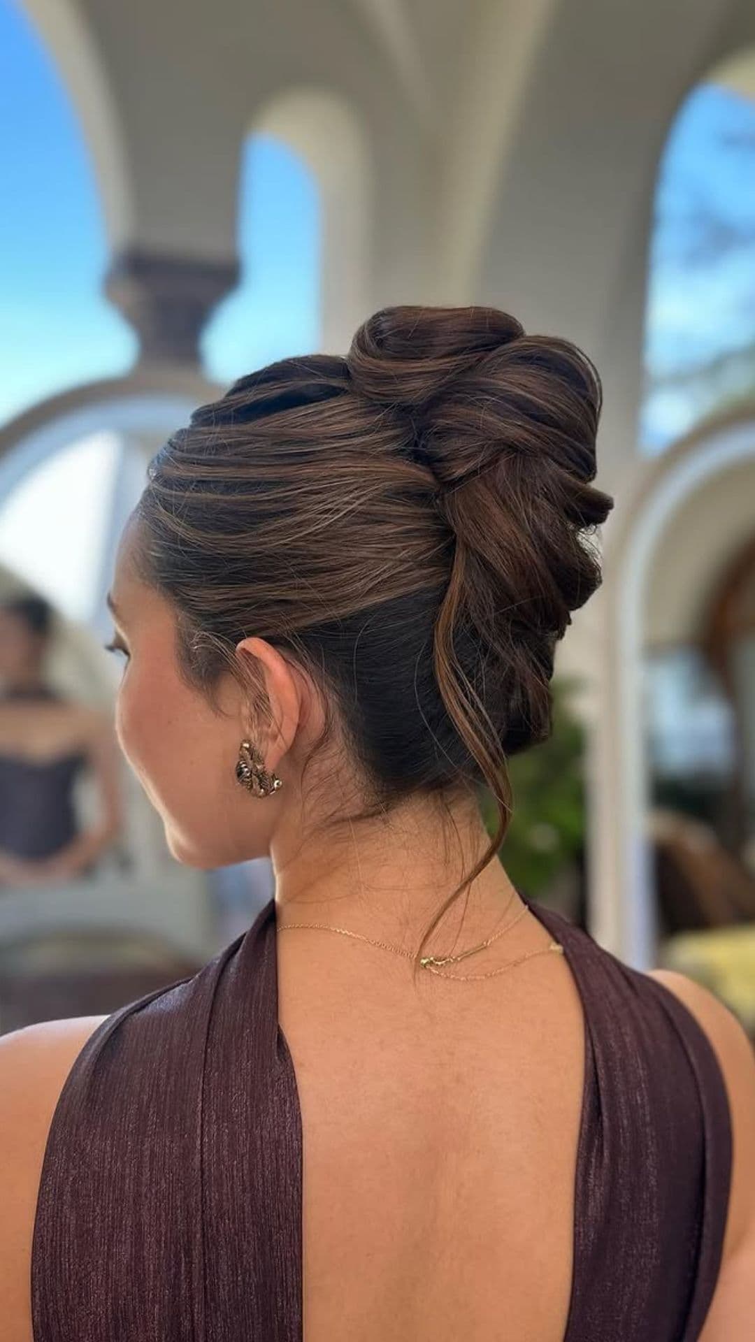 A woman modelling a French Twist hairstyle.