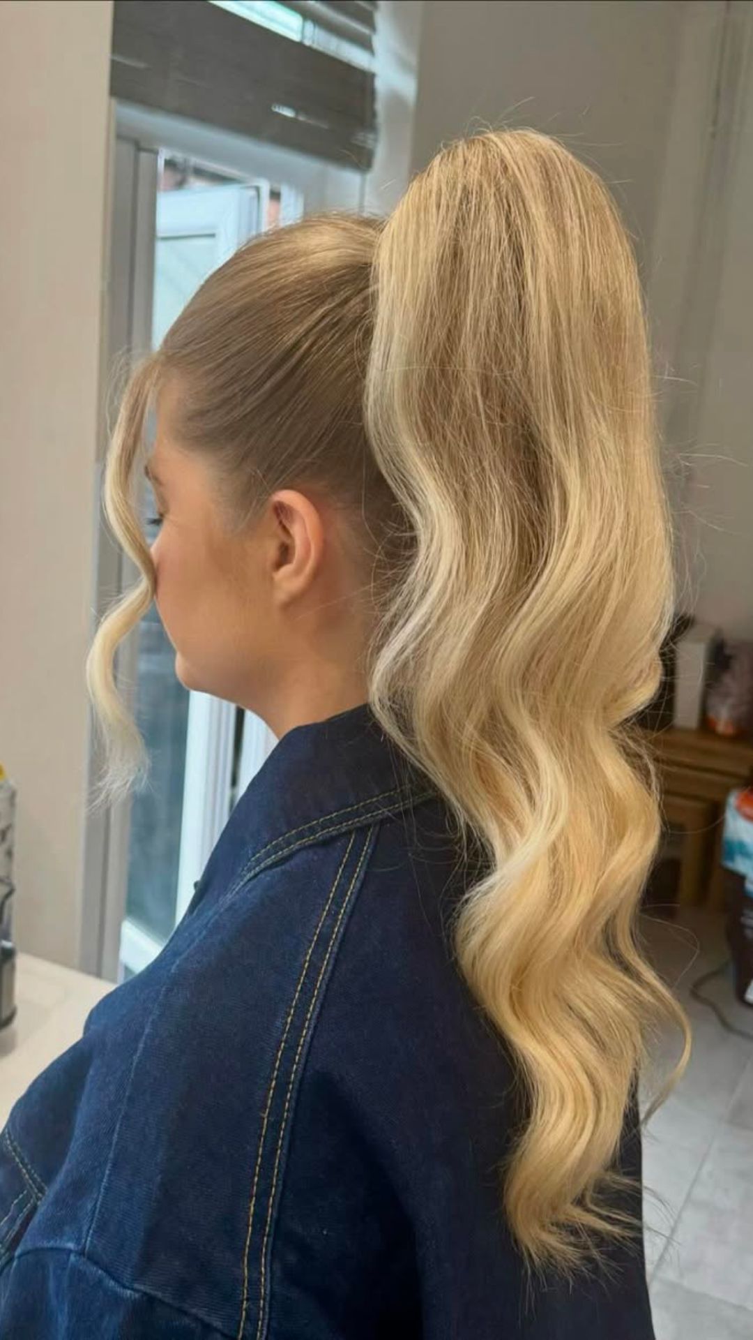 A round-faced woman with double chin modelling a High Ponytail hairstyle.