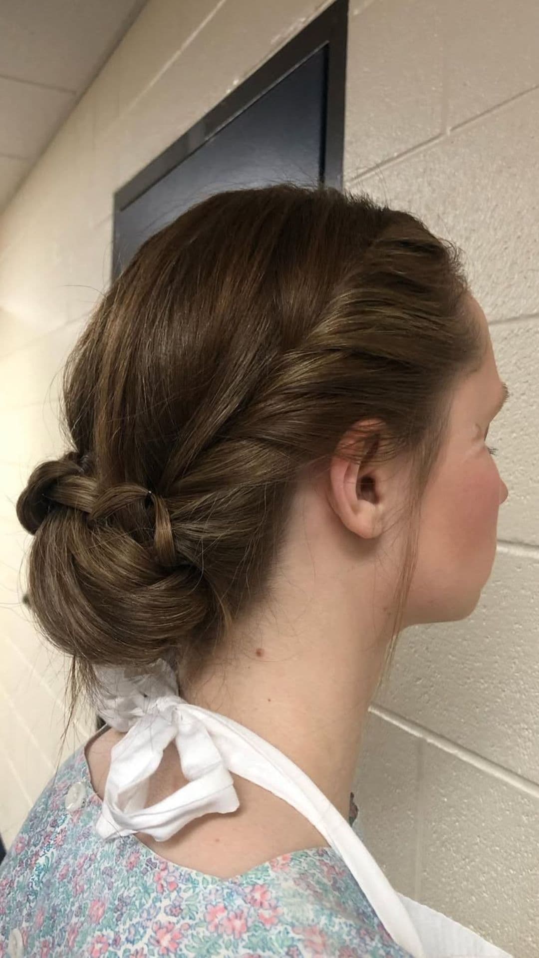 A woman modelling a Knotted Updo hairstyle.