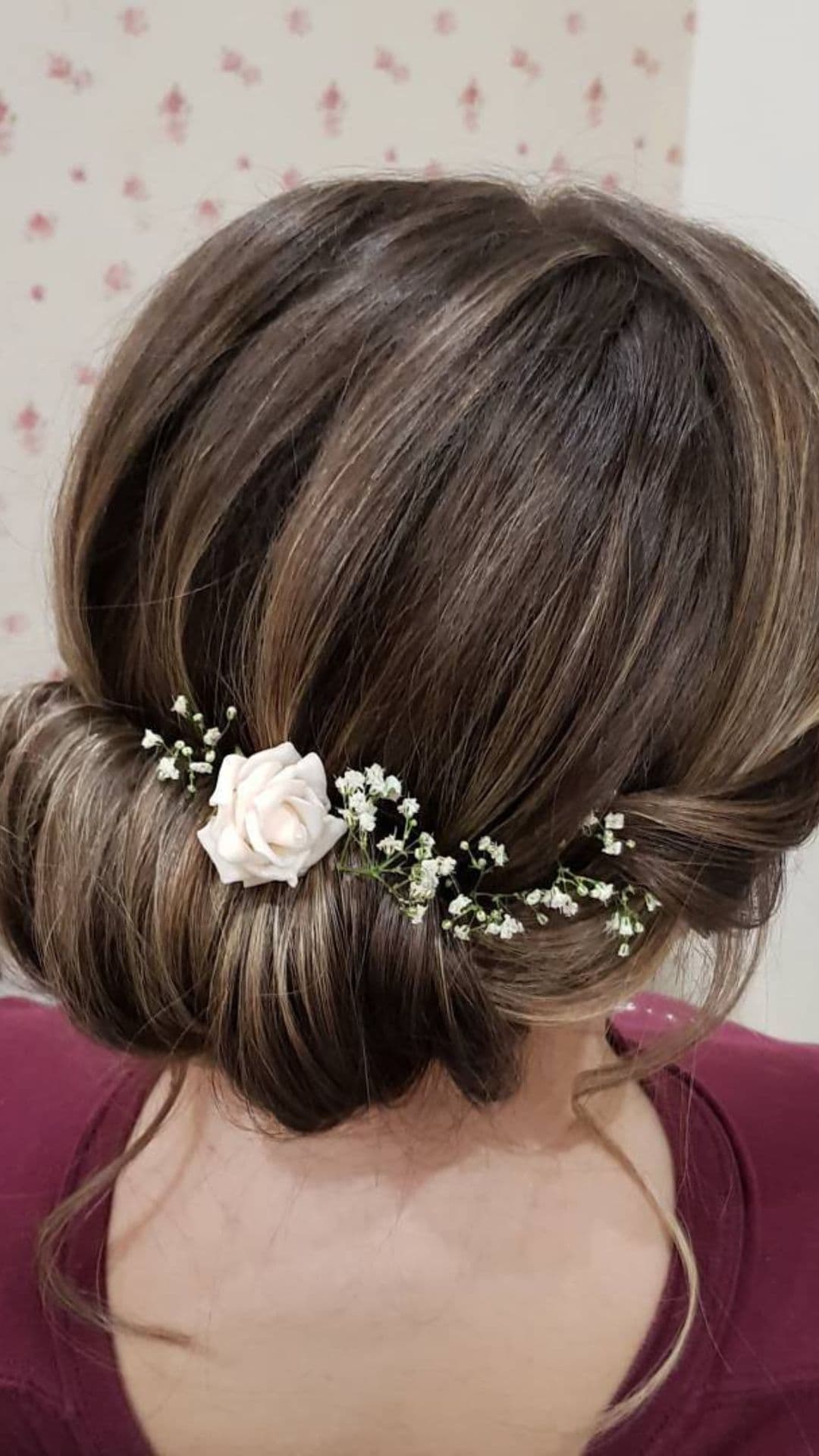 An old woman modelling a Low Rolled Bun hairstyle.