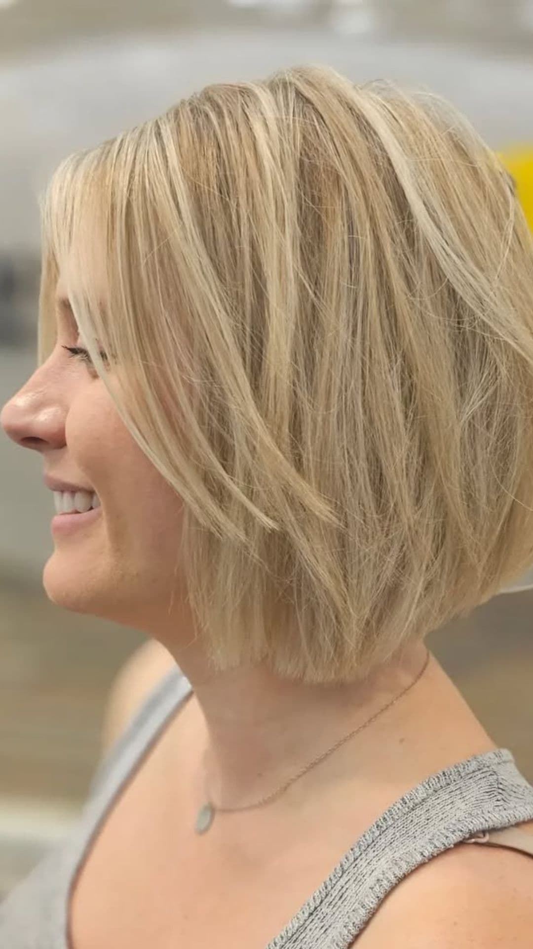 A woman with a round face modelling a Messy Bob hairstyle.