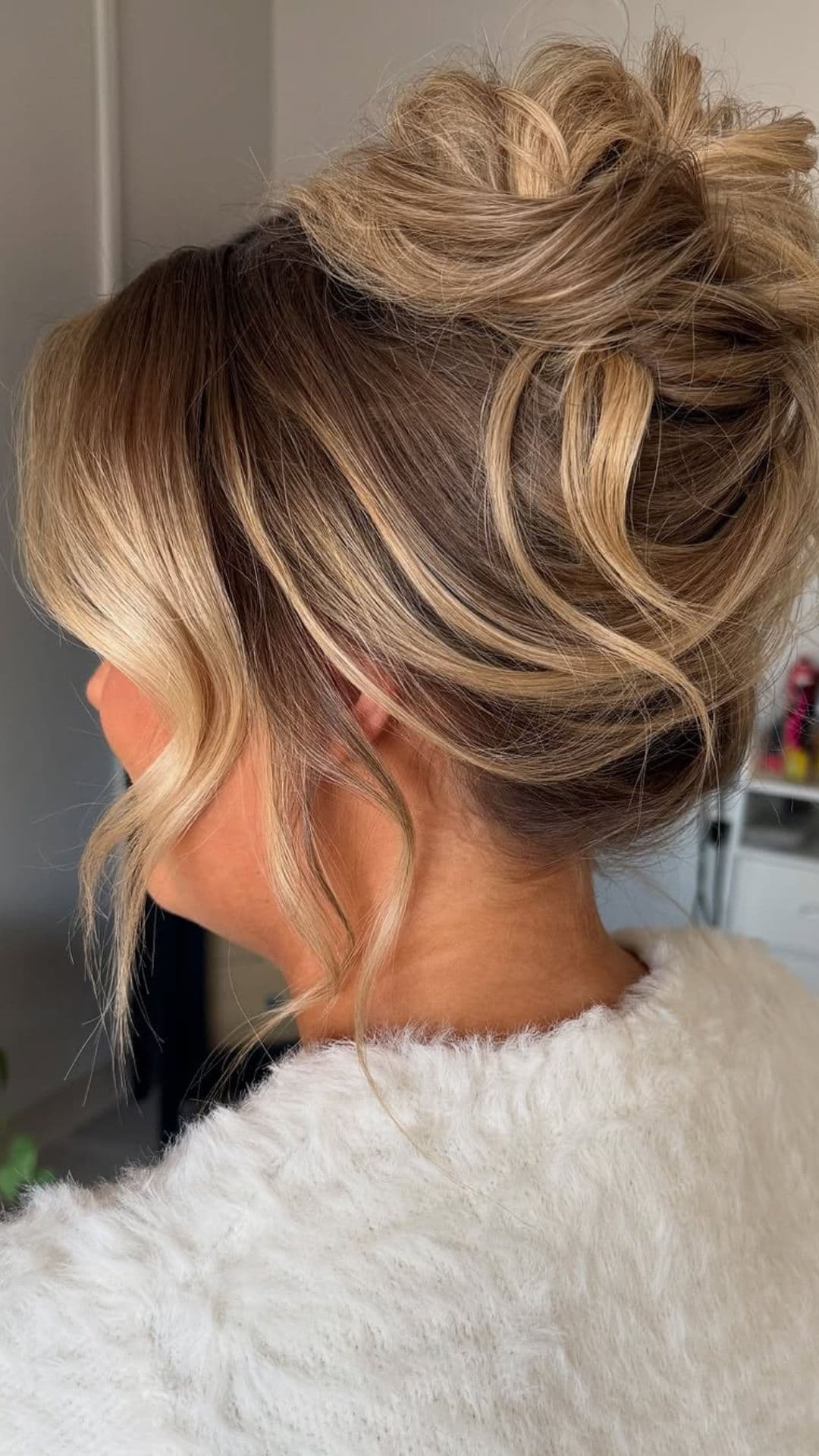 An old woman modelling a Messy Bun with Tendrils hairstyle.