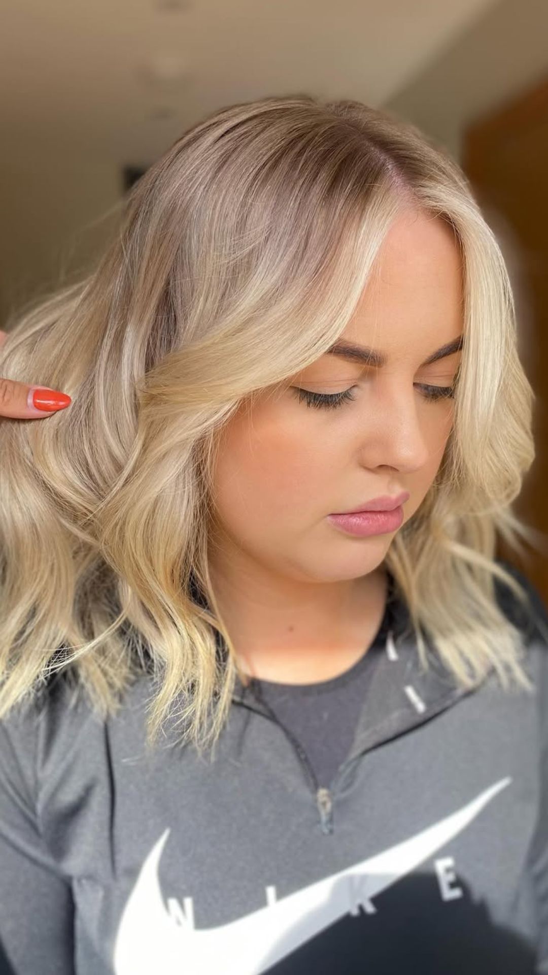 A round-faced woman with double chin modelling a Shoulder-Length Waves hairstyle.