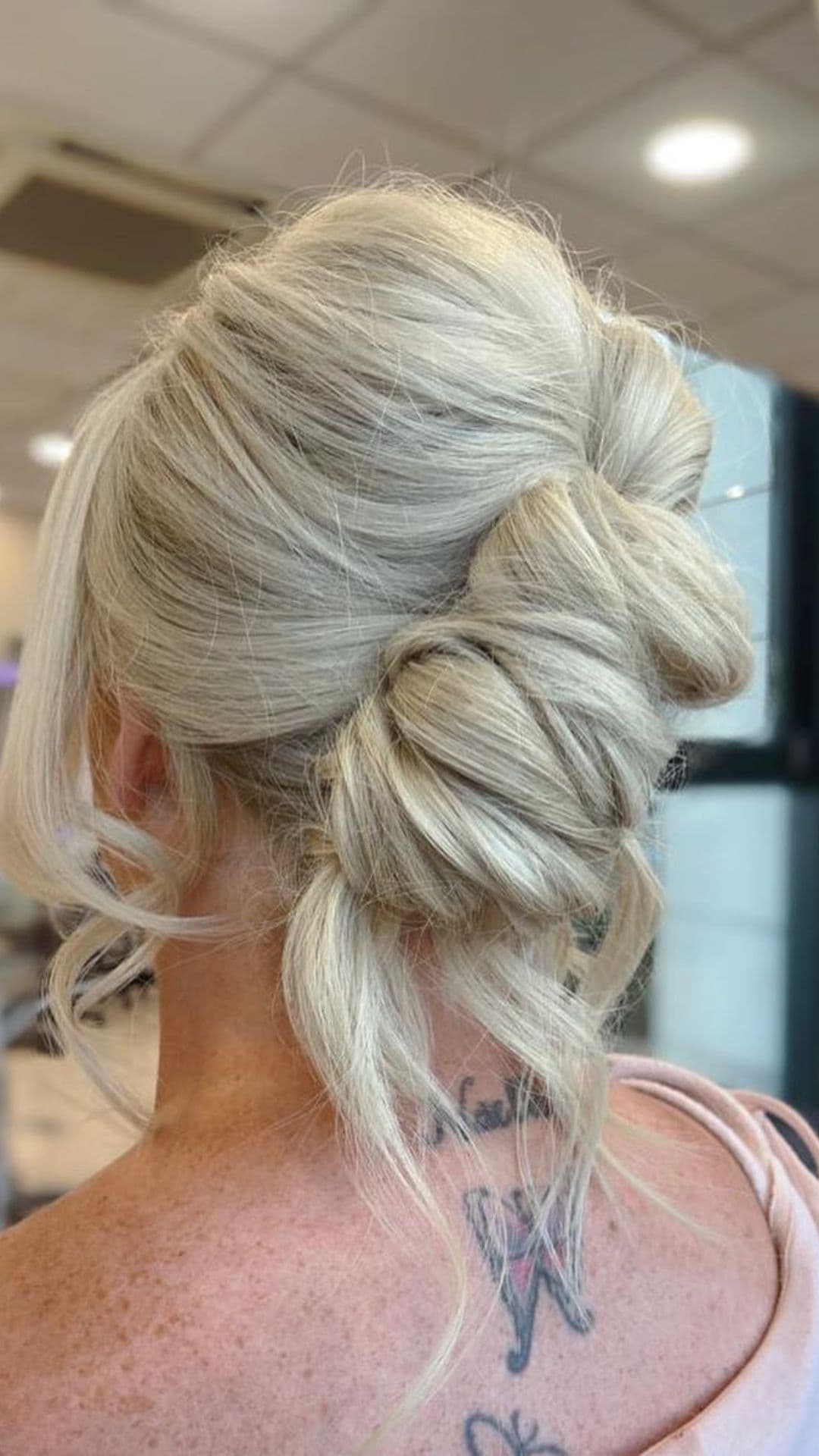 An old woman modelling a Simple Knotted Updo hairstyle.