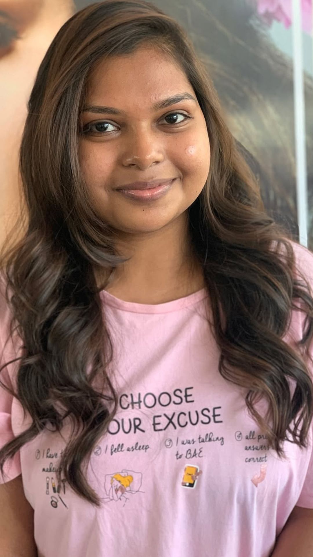 A round-faced woman with double chin modelling a Soft Curls hairstyle.